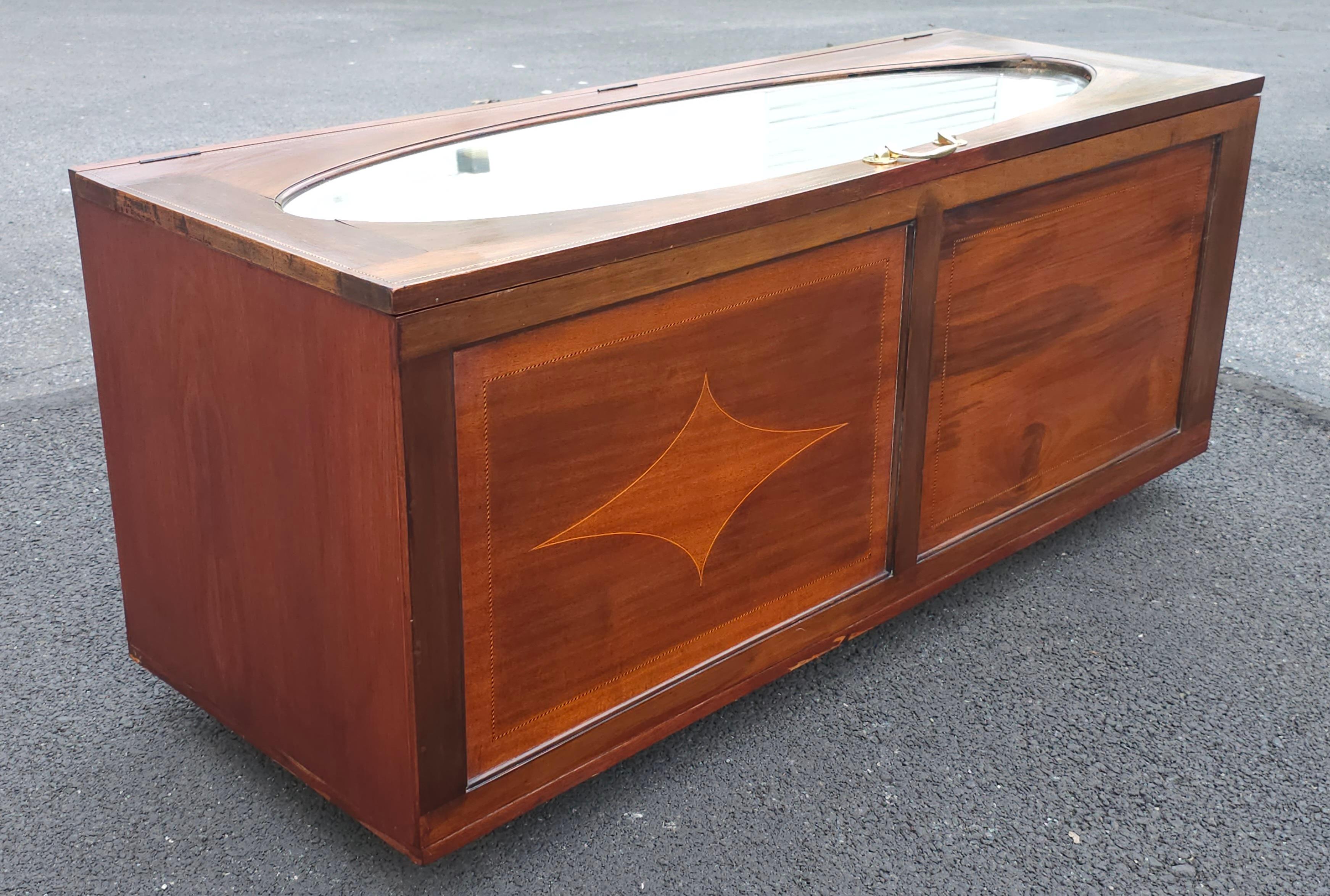 An exceptional late 19th Century Mahogany Inlaid and Mirrored Top Blanket Chest on Wheels. Measures 54