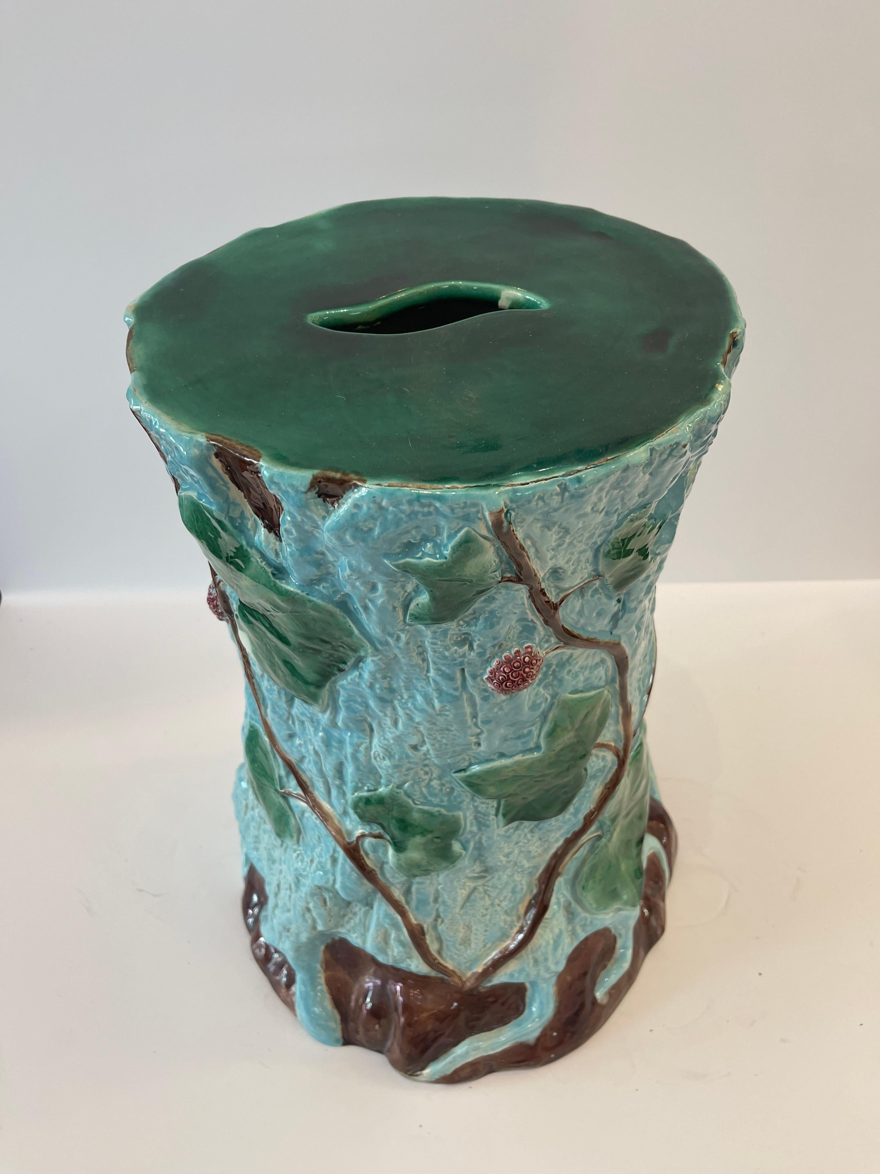 Just in this 19Th C. English Majolica Faux Tree Stump With Ivy Leaves and Berries attributed to Joseph Holdcroft, garden stool.
Beautiful turquoise color to the background and Green vines and berries all around.
This garden stool is in remarkable