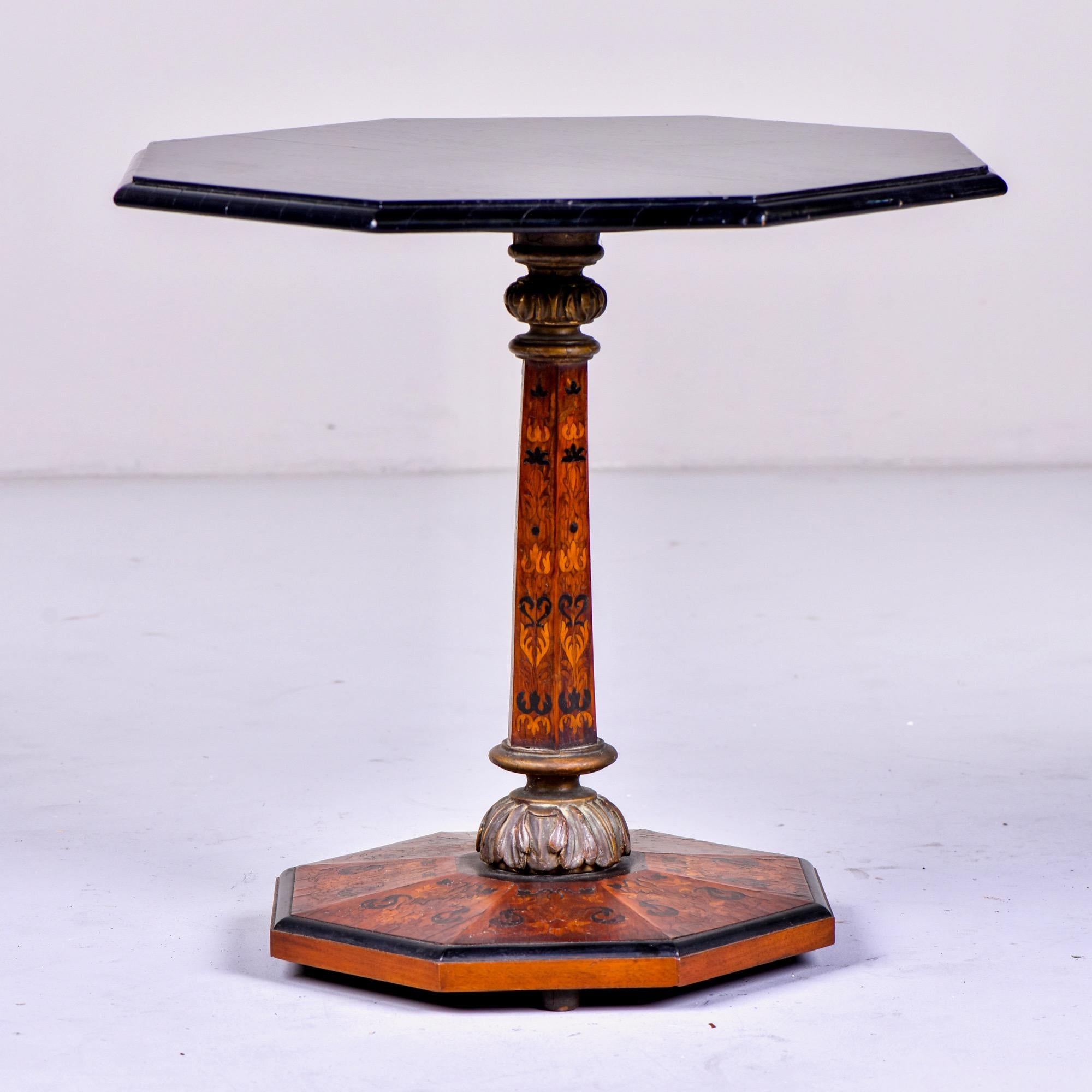 English side table features an octagonal base and center support with marquetry and an eight-sided black lacquered top, circa 1880s. Unknown maker.