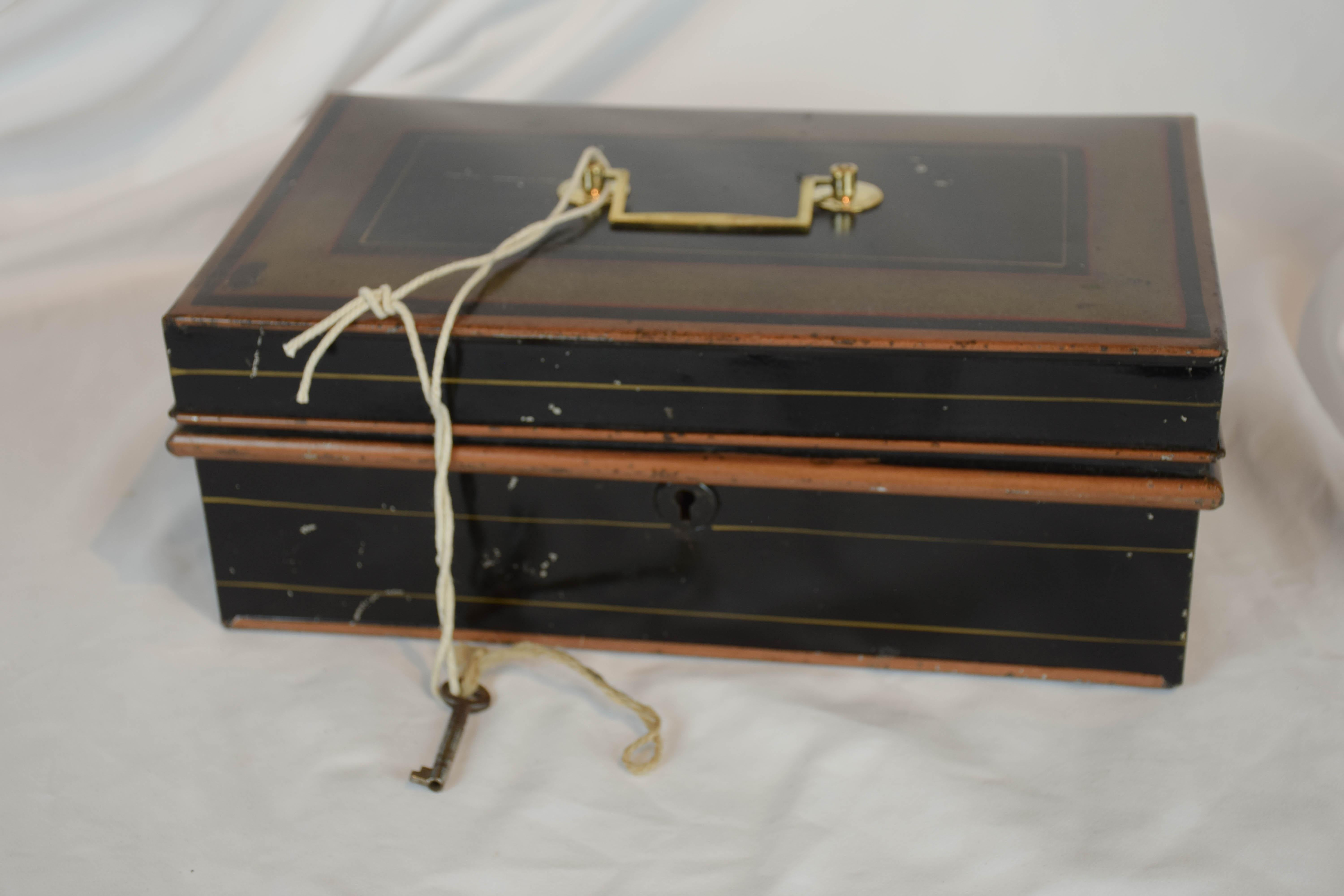 We found this 19th century metal cash box in the English countryside. It has beautiful original painted patina, a brass handle and the original key.
