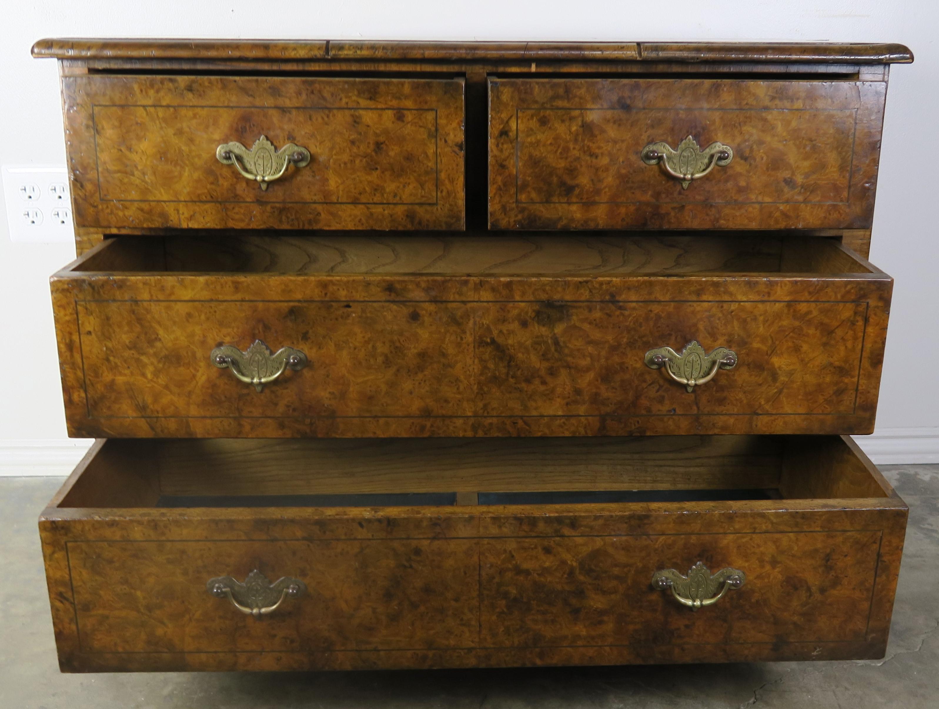 19th century English oyster veneered chest of drawers. Brass handles.