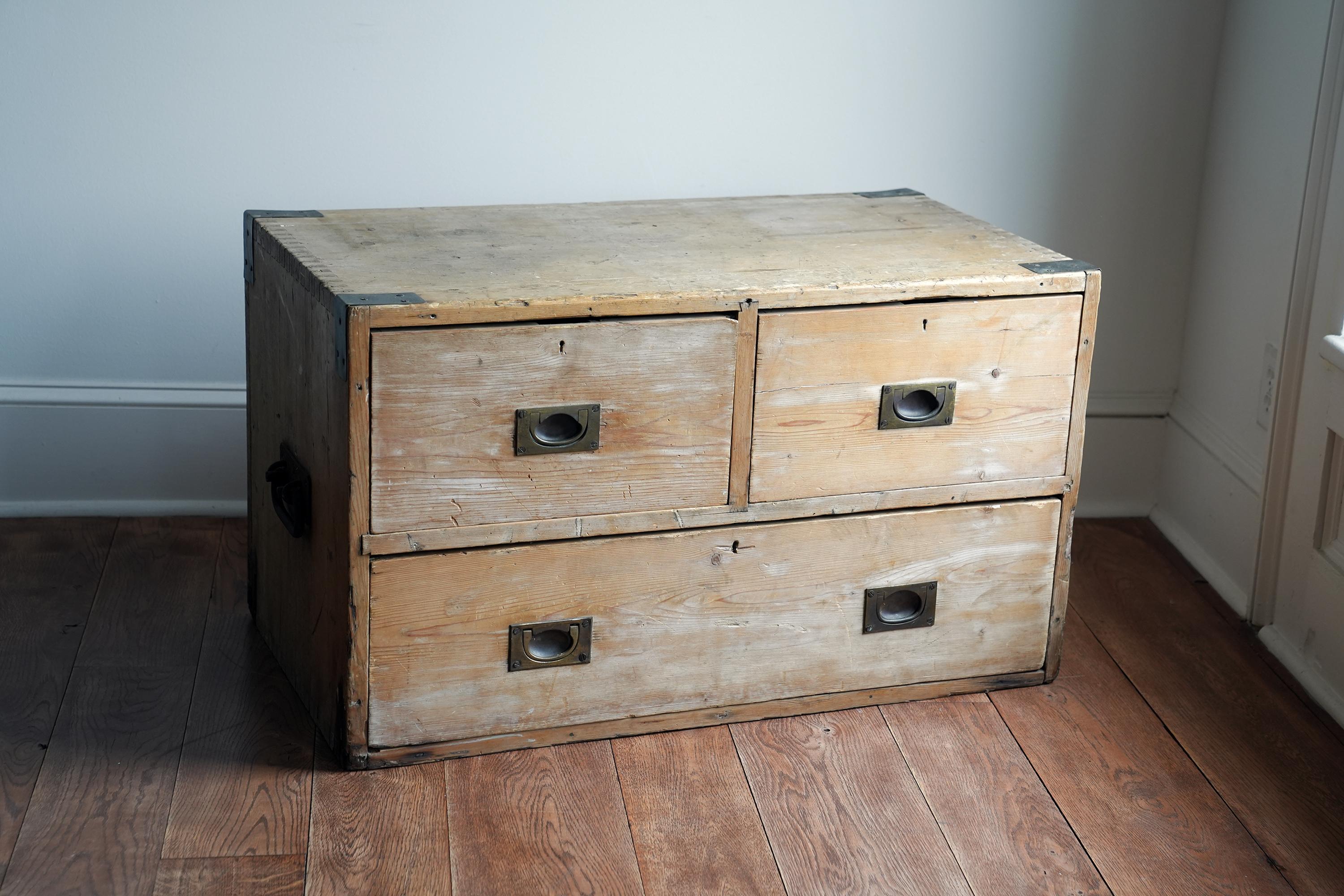 This is a beautiful and storied 19th centry campaign chest with perfect patina.
Good low storage for an entry, at the end of a bed or even use as a coffee table. Nice finished back so this piece doesn't have to be placed against a wall. Solid
