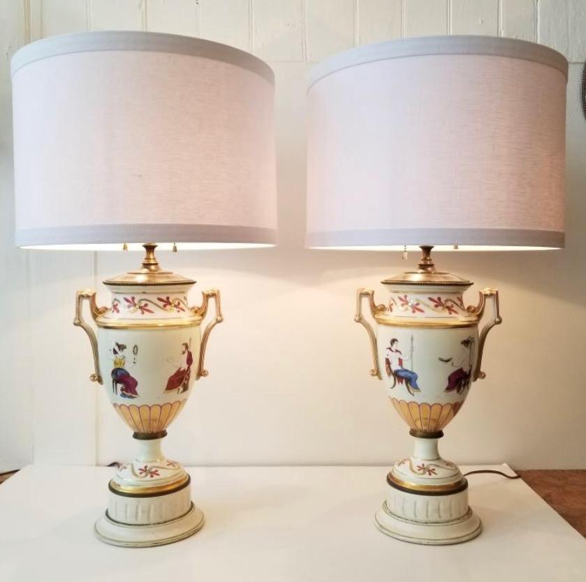 Elegant Pair of English porcelain white cream lamps with Greek motifs on painted wooden bases.