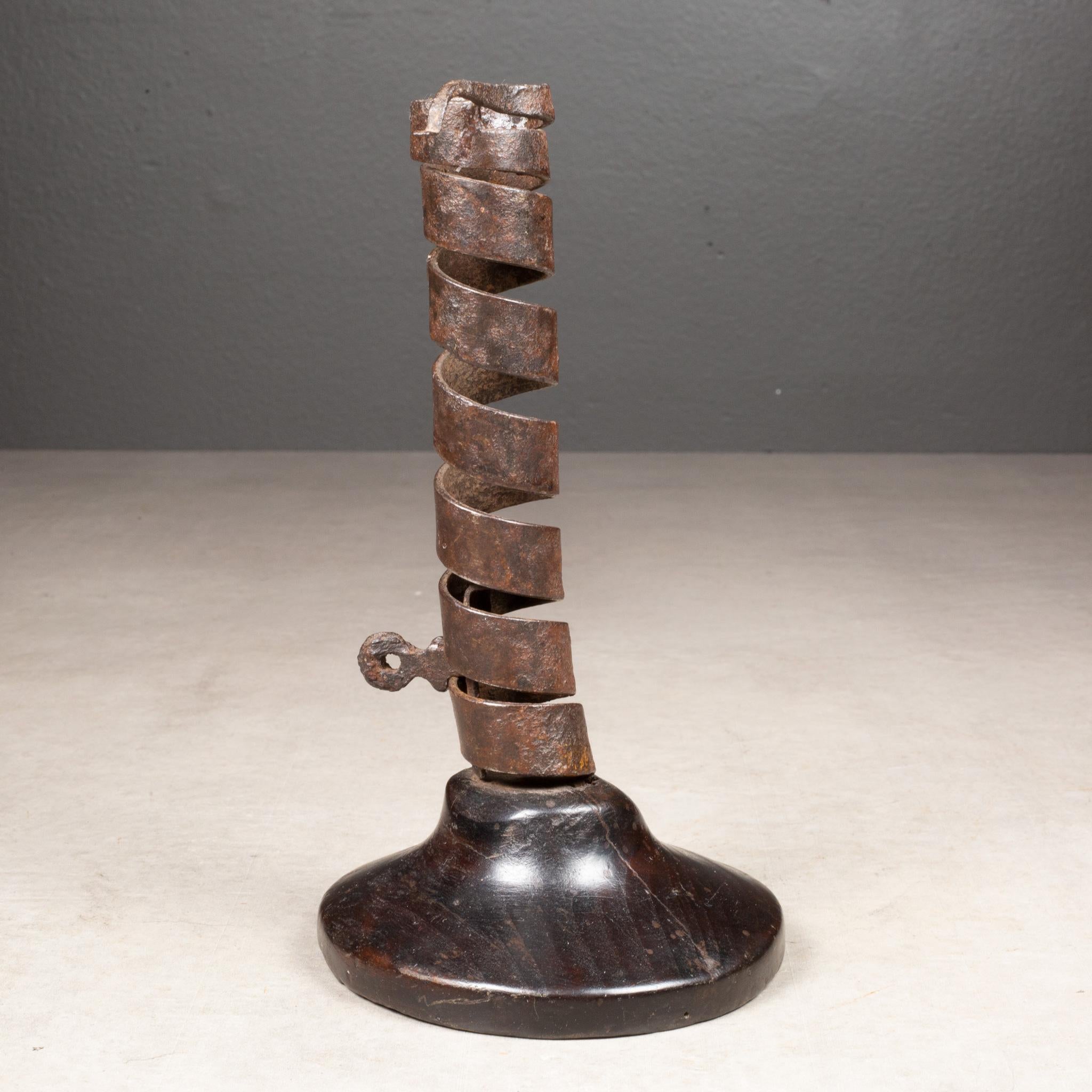 ABOUT

English spiral twist candlestick, circa 1870s. Fashioned from hand wrought iron and original turned Oak base. Includes candle ejector that was used to move the candle up as it burned.

    CREATOR Unknown. United Kingdom. 
    DATE OF