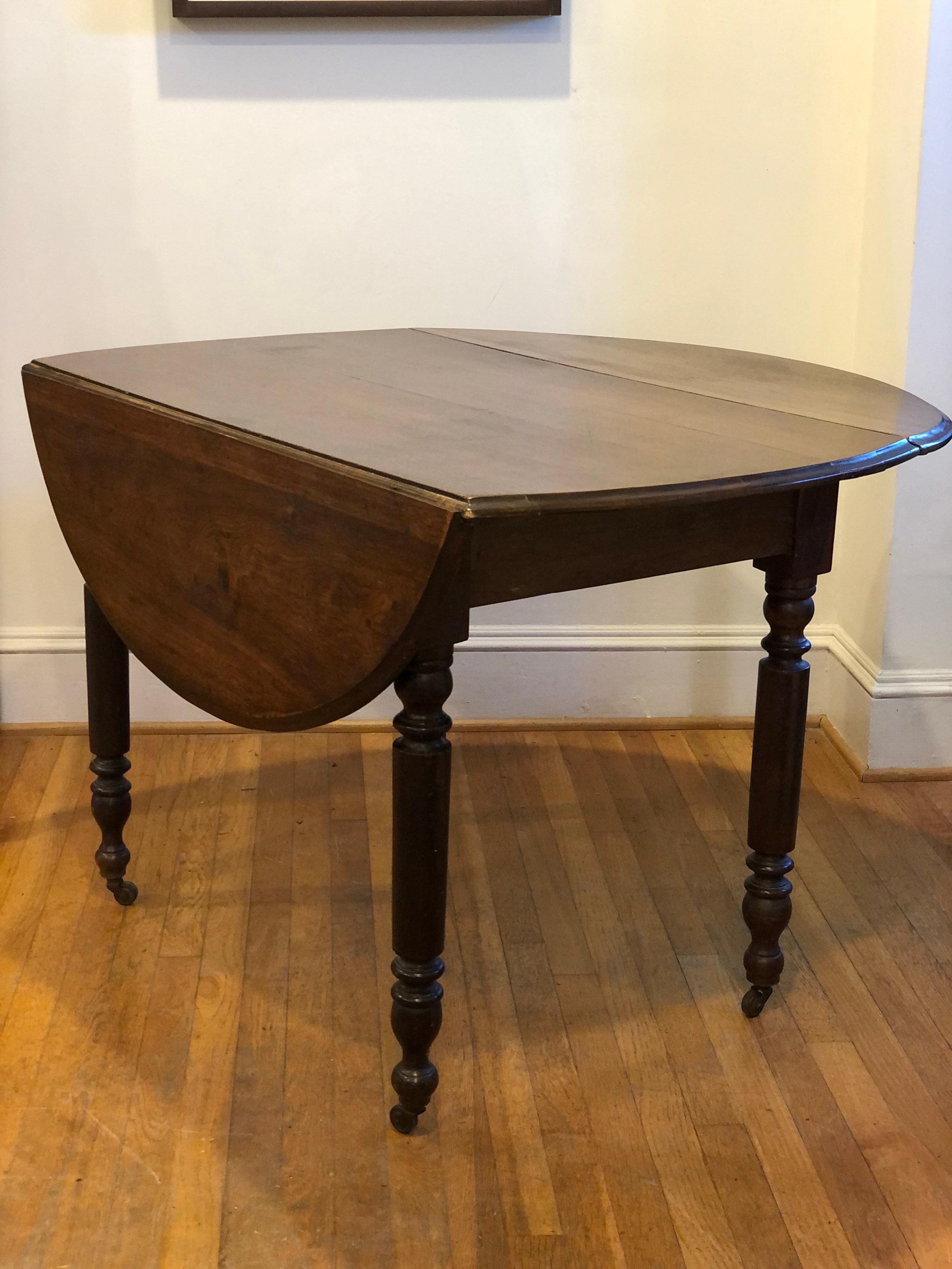 19th Century 19th C. English Walnut Drop Leaf Table with Oval Top For Sale