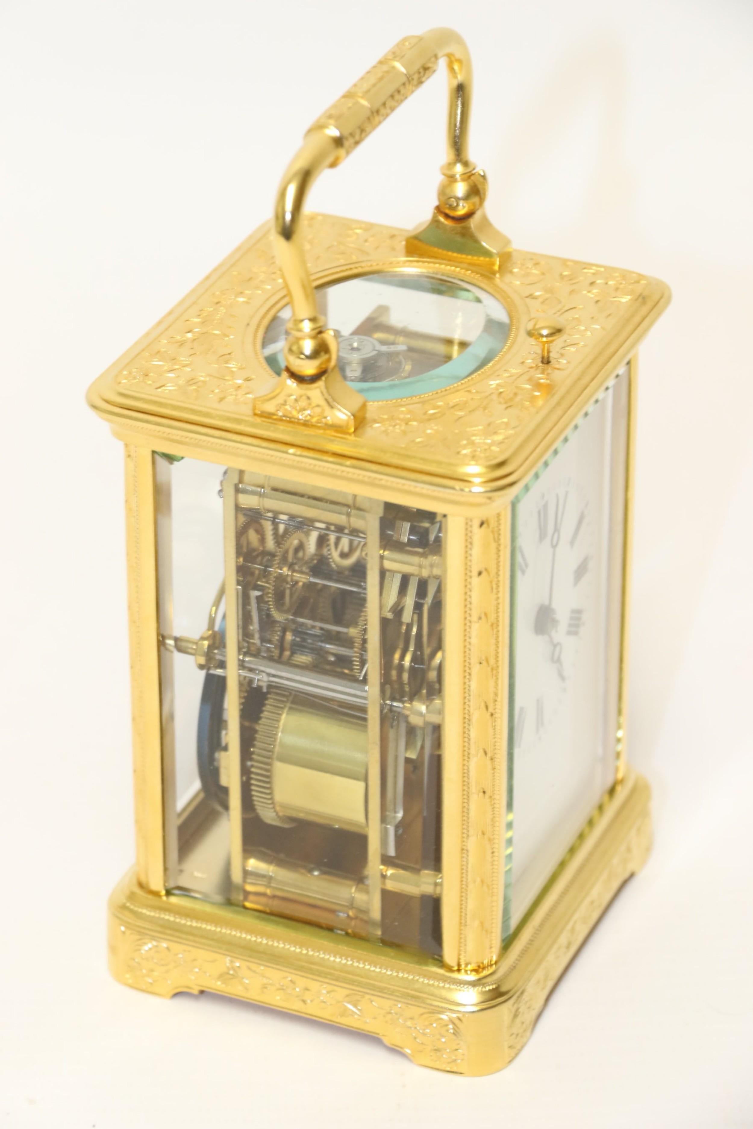 This beautiful carriage clock dates to circa 1900 and made in France.

The clock has an a eight day striking and repeating movement (escapement replaced at some point) and is housed in a fine gilt case with detailed flowers and leaves hand