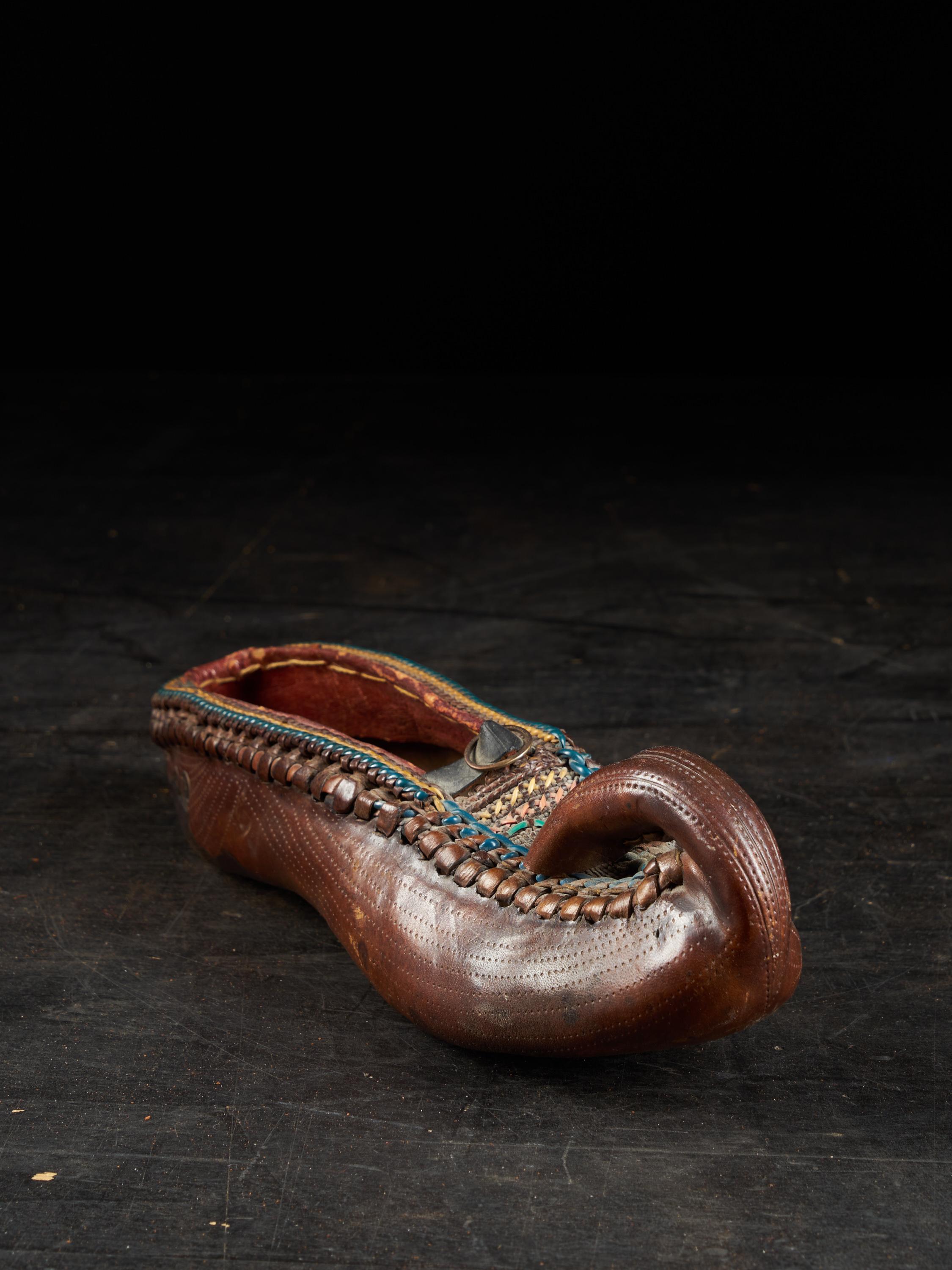 Hand-Crafted 19th Century Ethnic Leather Decorated Woman's Shoe For Sale