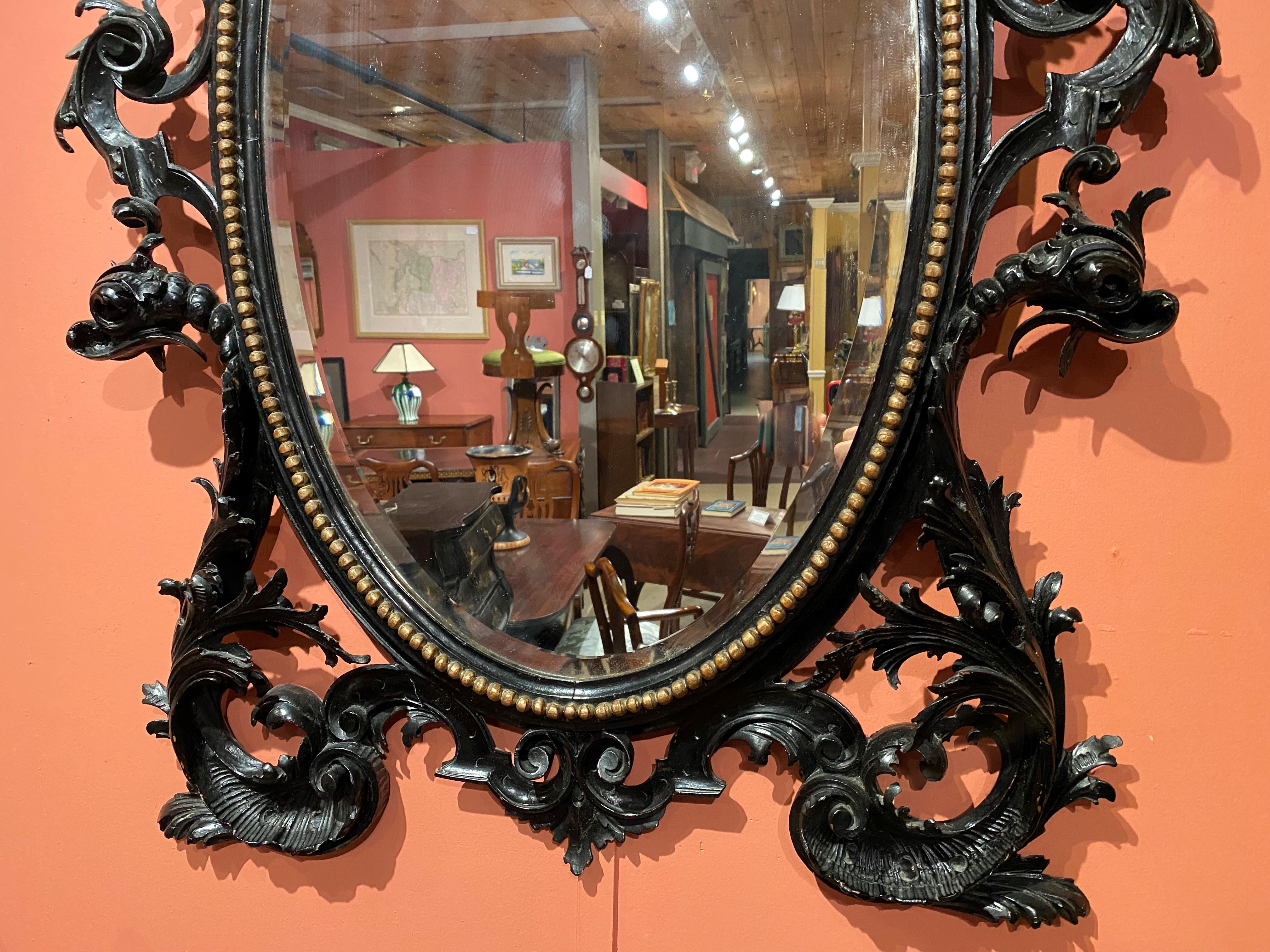 Rococo 19th C European Carved Ebonized Oval Mirror in the Chinese Chippendale Taste