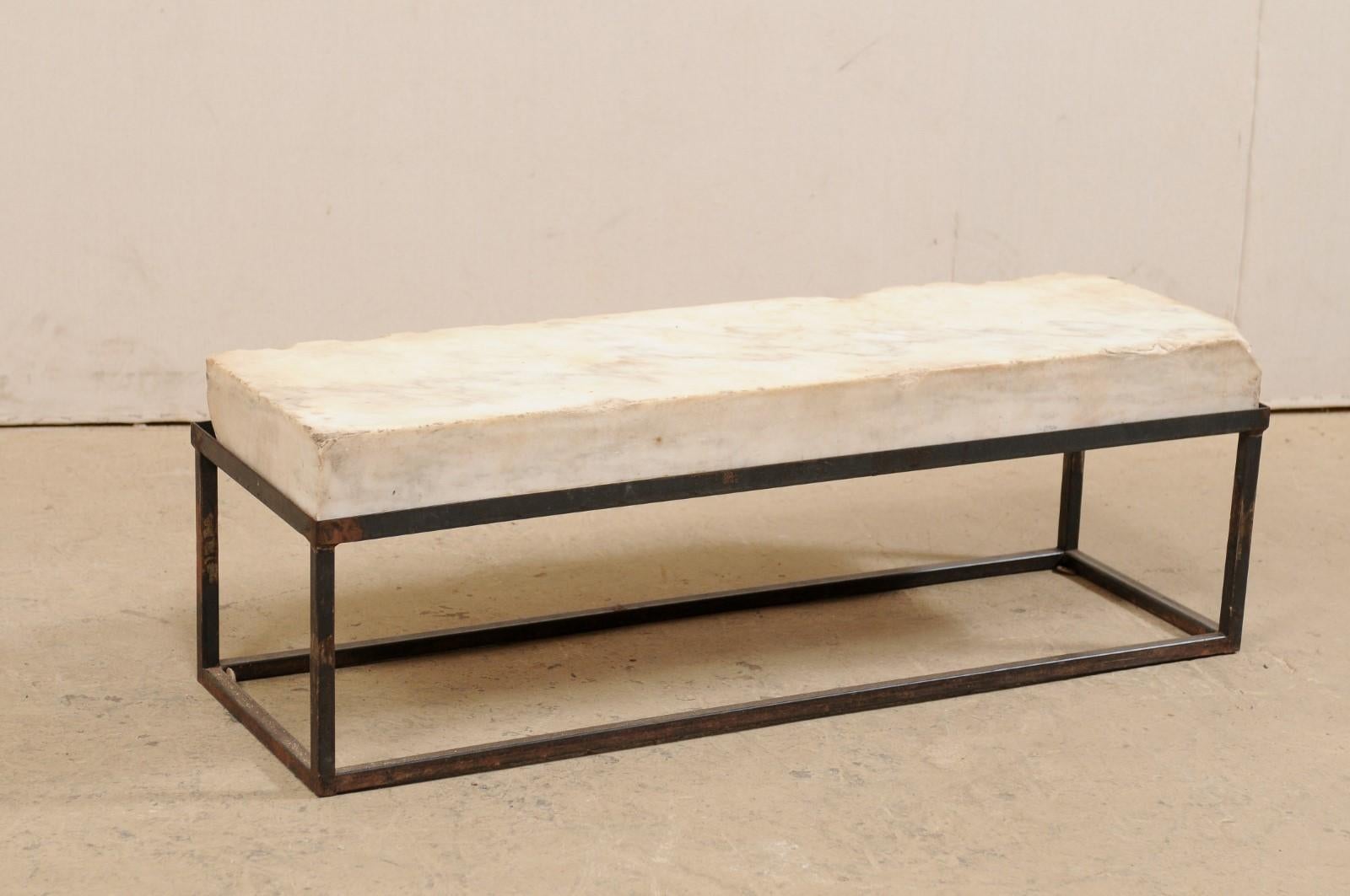 A 19th century European marble slab top coffee table, with custom iron base (which could double as a bench!). This unique coffee table has been fashioned from a thick rectangular-shaped slab of 19th century marble, which is raised on a new custom