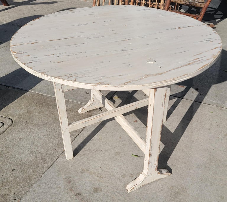 Early 19th C folding wine tasting table. Table was painted later but is original. This great table can be used in a small space as a nook / dining table and can be stored nicely due to it be a folding.
 