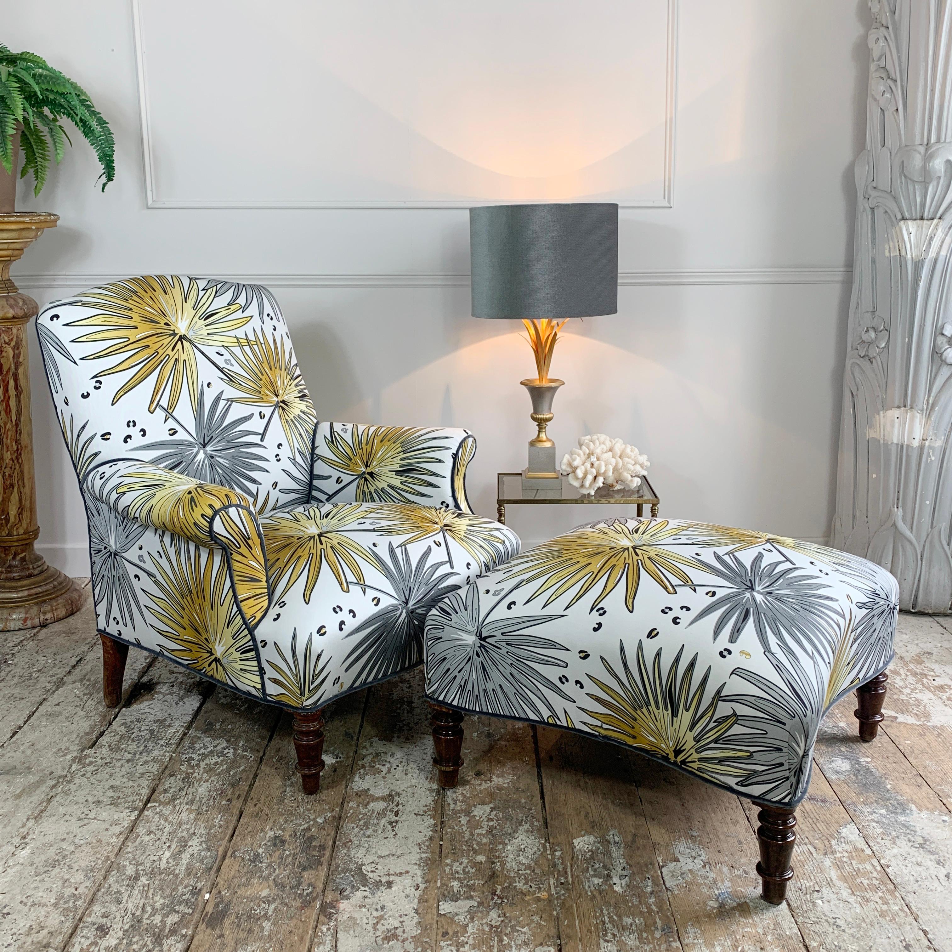 A beautiful 19th century French Napoleon lll armchair and footstool, upholstered in our exclusive Tropics 'Fan Palm' fabric.

This stunning Armchair and Footstool dating from around 1860, have been painstakingly covered in the luxurious Fan Palm