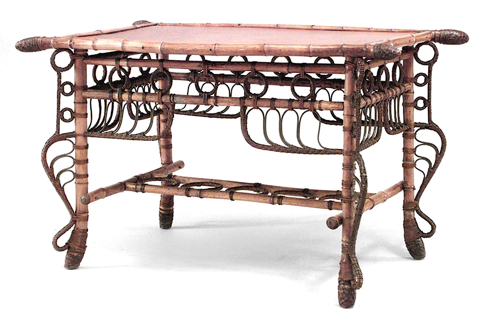 French Victorian bamboo rectangular center table with shaped brown leather top and woven wicker circle design on apron and stretcher
