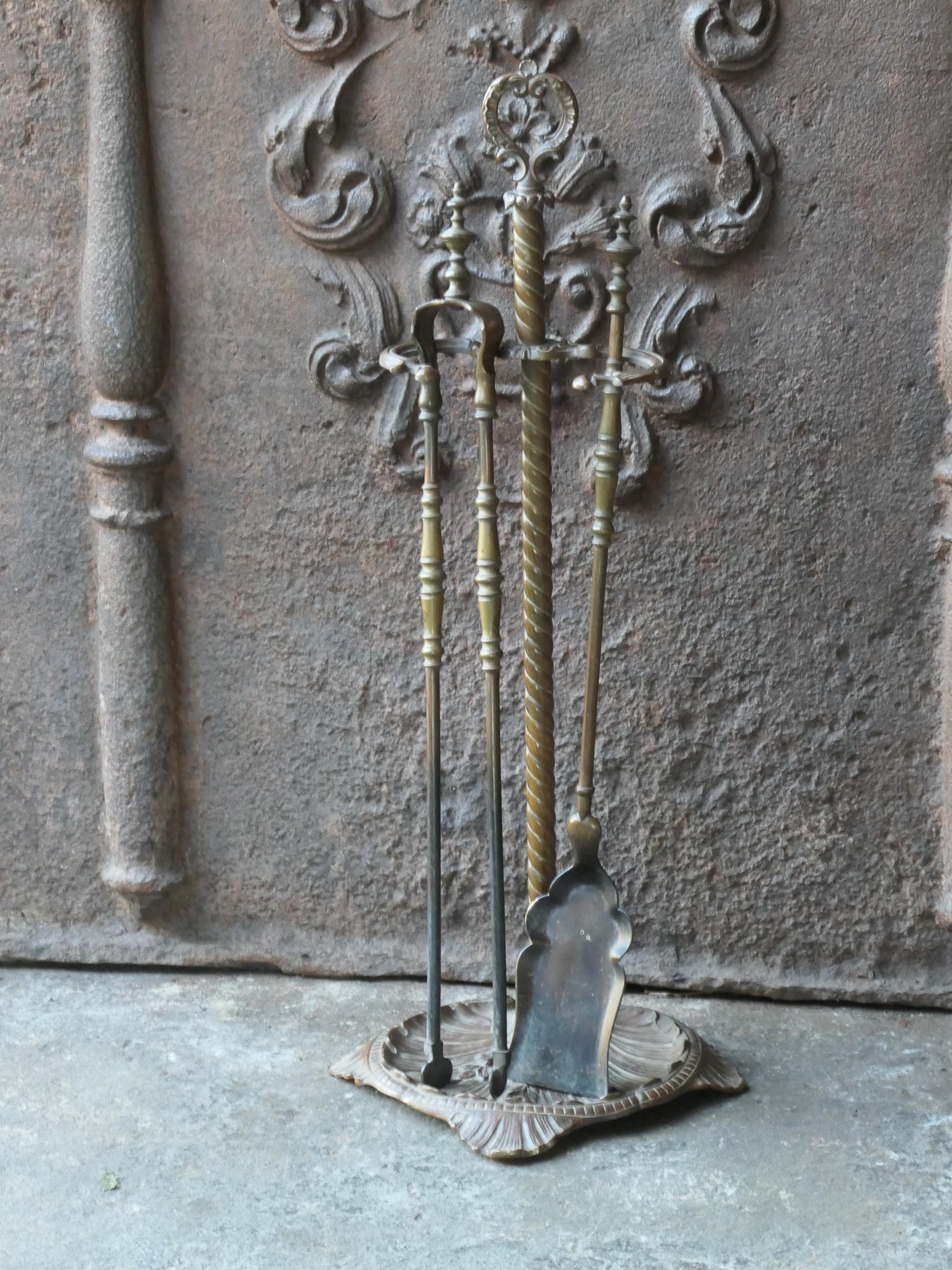 19th Century French Napoleon III period fire companion set. The tool set consists of thongs, shovel and stand. Made of brass. It is in a good condition and is fully functional.