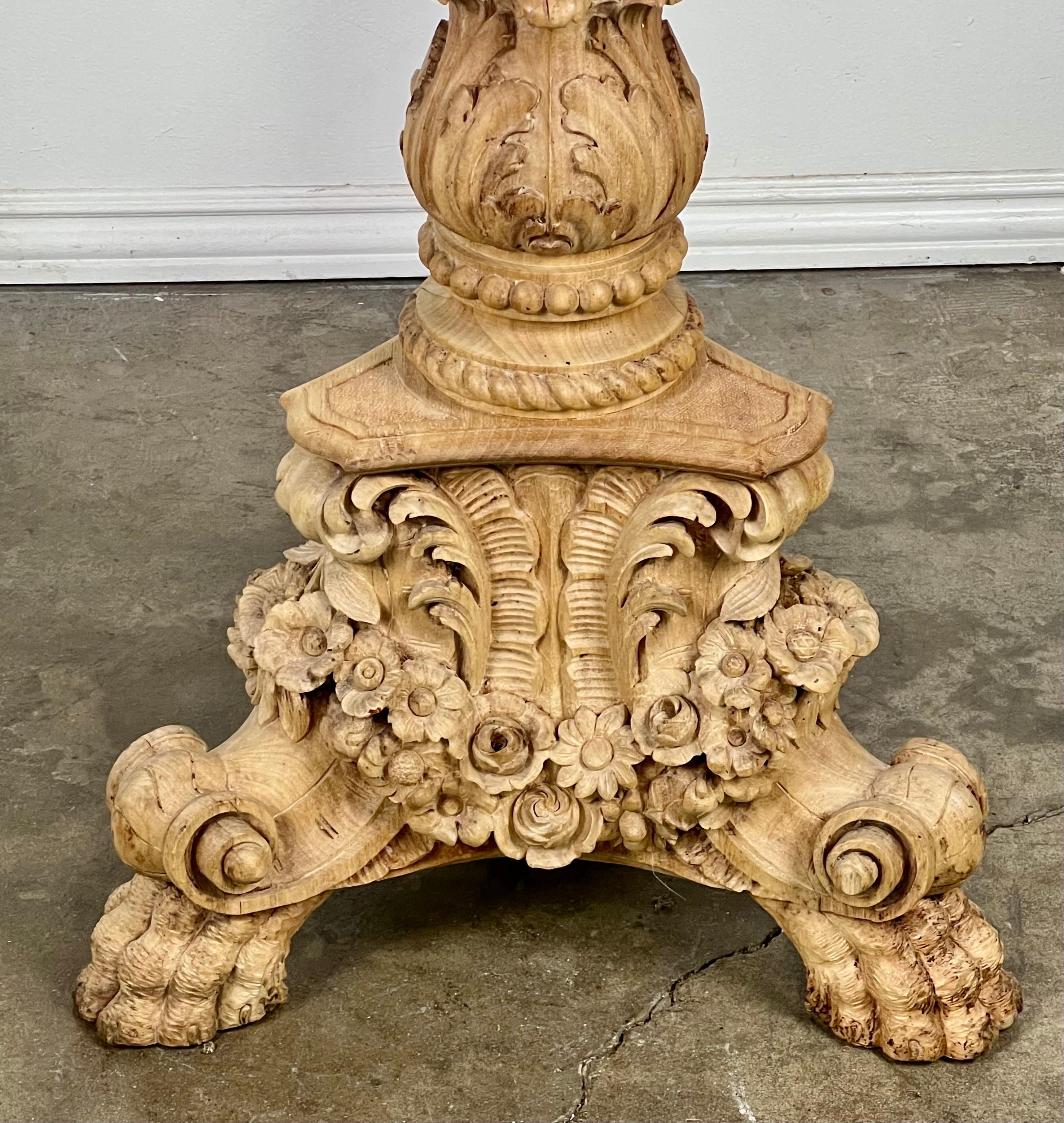 19th C. carved wood Louis XV style French standing lamp.  The lamp has a tripod base and sits on beautifully carved paw feet.  The base is also decorated with carved flowers, acanthus leaves and scrolls.  The lamp is made of a bleached walnut and