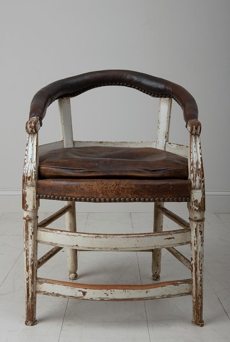 A French cello musician's armchair in time-worn original patina and leather. This rare 19th c. model was last owned by a musician who played his cello in this chair for 50 years. An amazing find sourced from northern France.