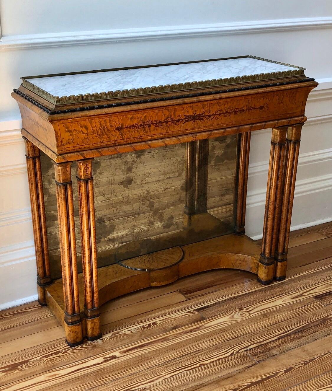 This elegant Charles X jardinière has an Anthemion Brass Gallery with inset marble top. The console has figured bird’s-eye maple with exceptional tulipwood, amaranth and ebonized inlay. The Architectural Design is prevalent in the Classical Inlay