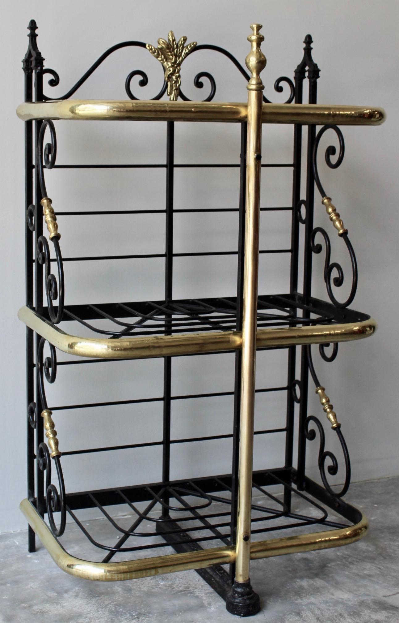Iron and brass French table or counter top bakers rack. Made in France circa 1890 of the highest quality this Bakers Rack is exceptional in its petite size. Originally made for baked goods, this rack could easily and elegantly be used for storage of