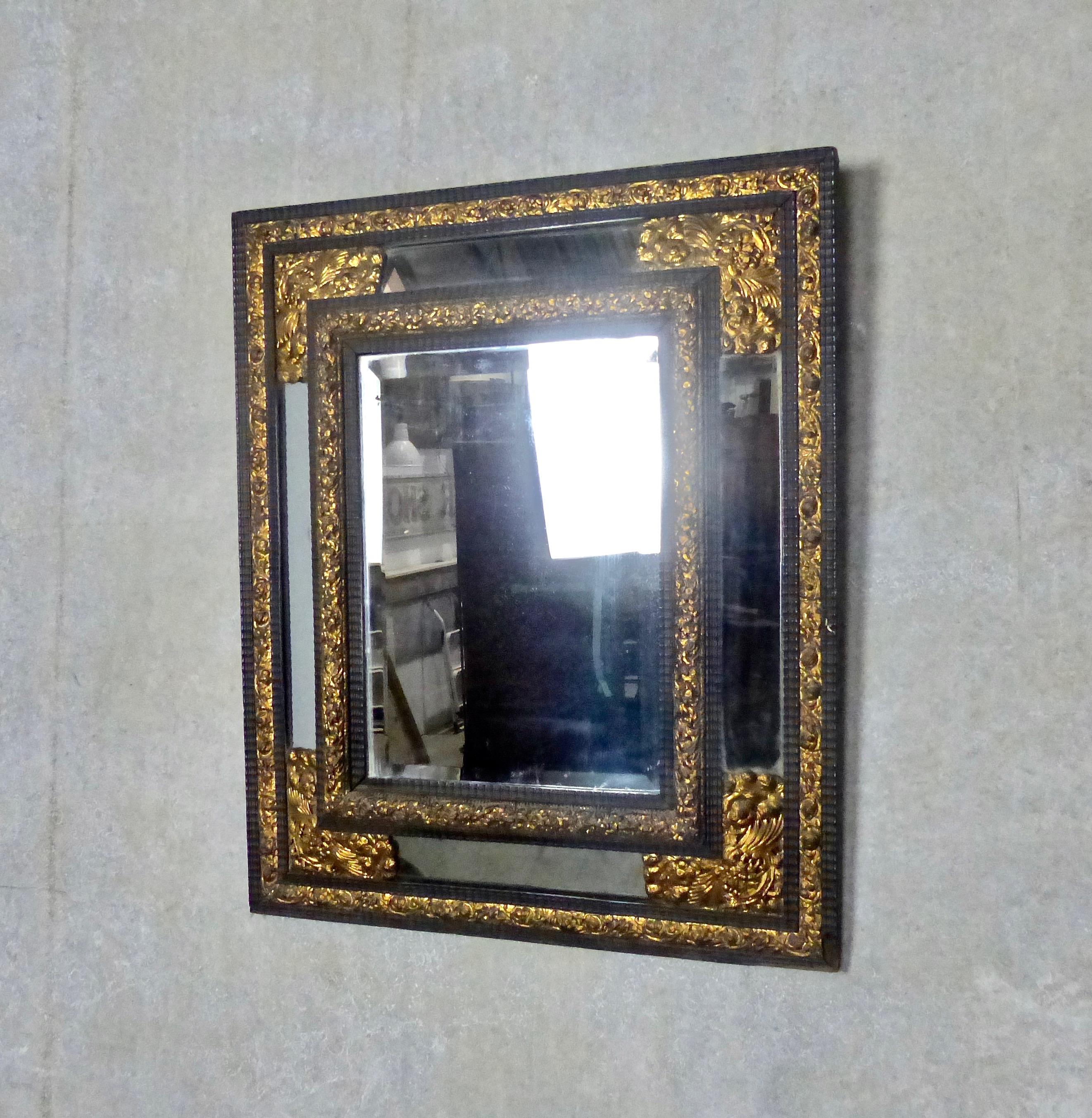Repoussé 19th Century French Ebony Mirror with Gilt Repousse Brass