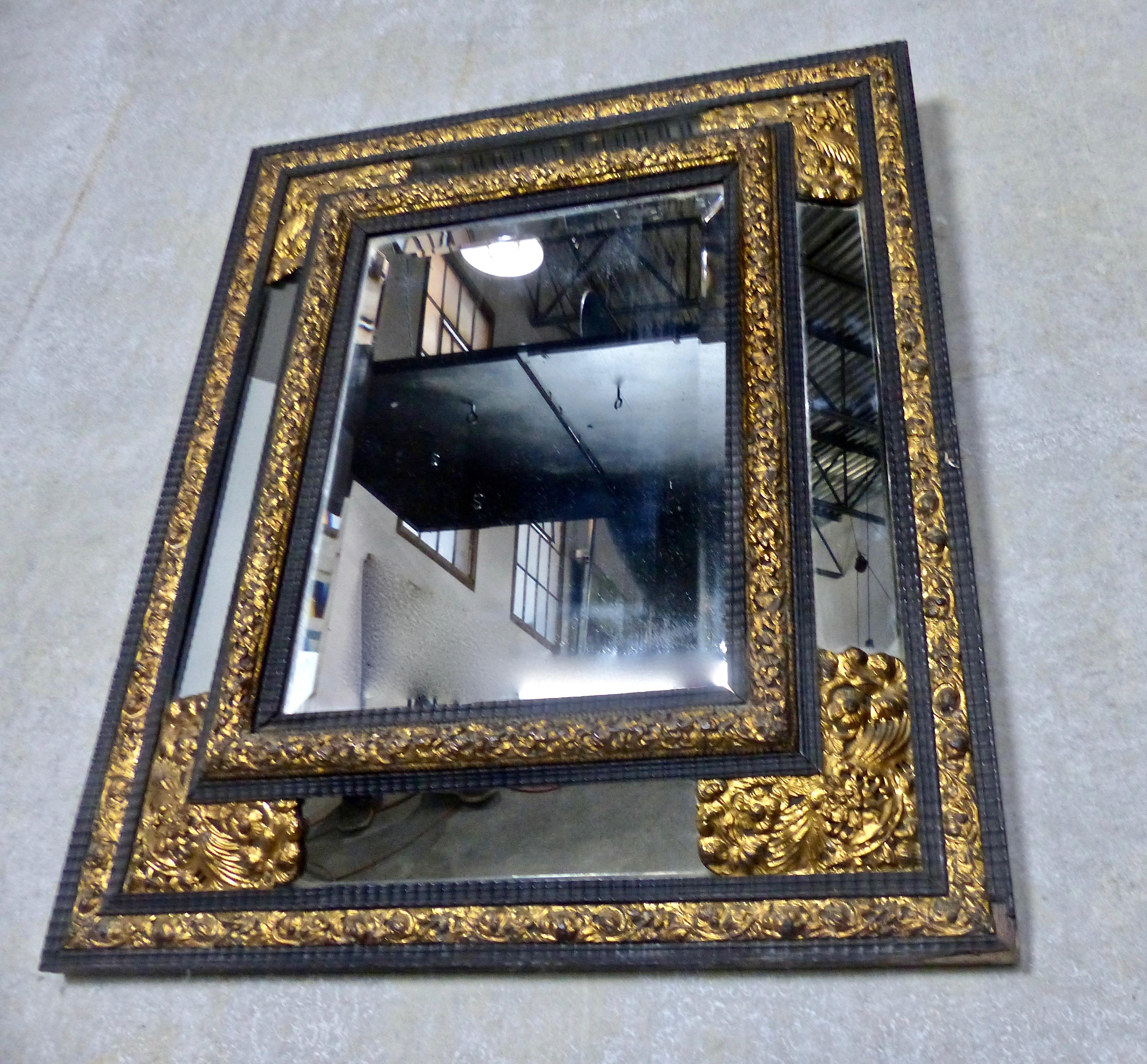 Late 19th Century 19th Century French Ebony Mirror with Gilt Repousse Brass