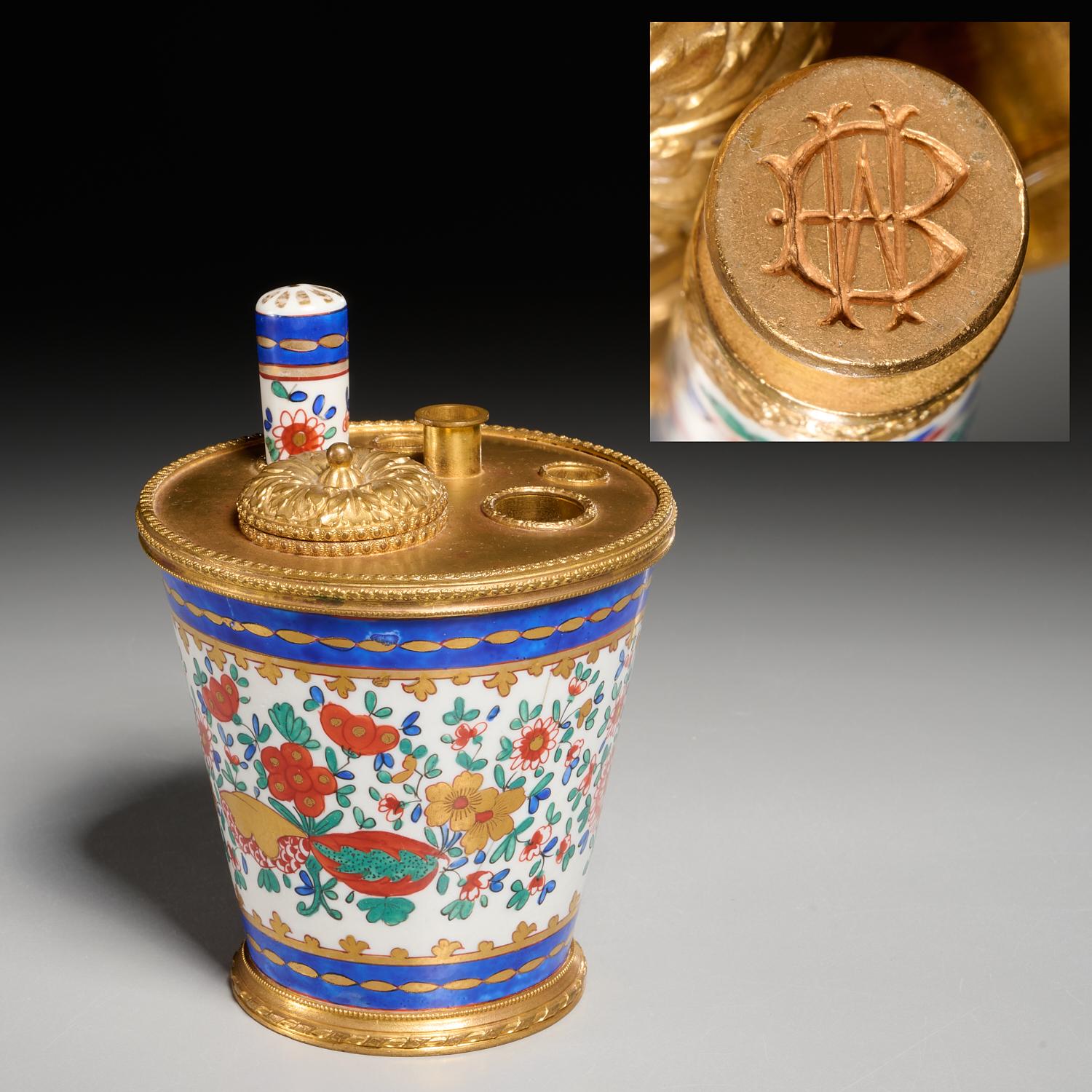 19th c., France, an ormolu, gilt and polychrome enameled porcelain encrier or inkwell in pot form. It is decorated with flowering vines, the gilt bronze top with wells for writing implements and lidded inkwell holder, including porcelain wax seal