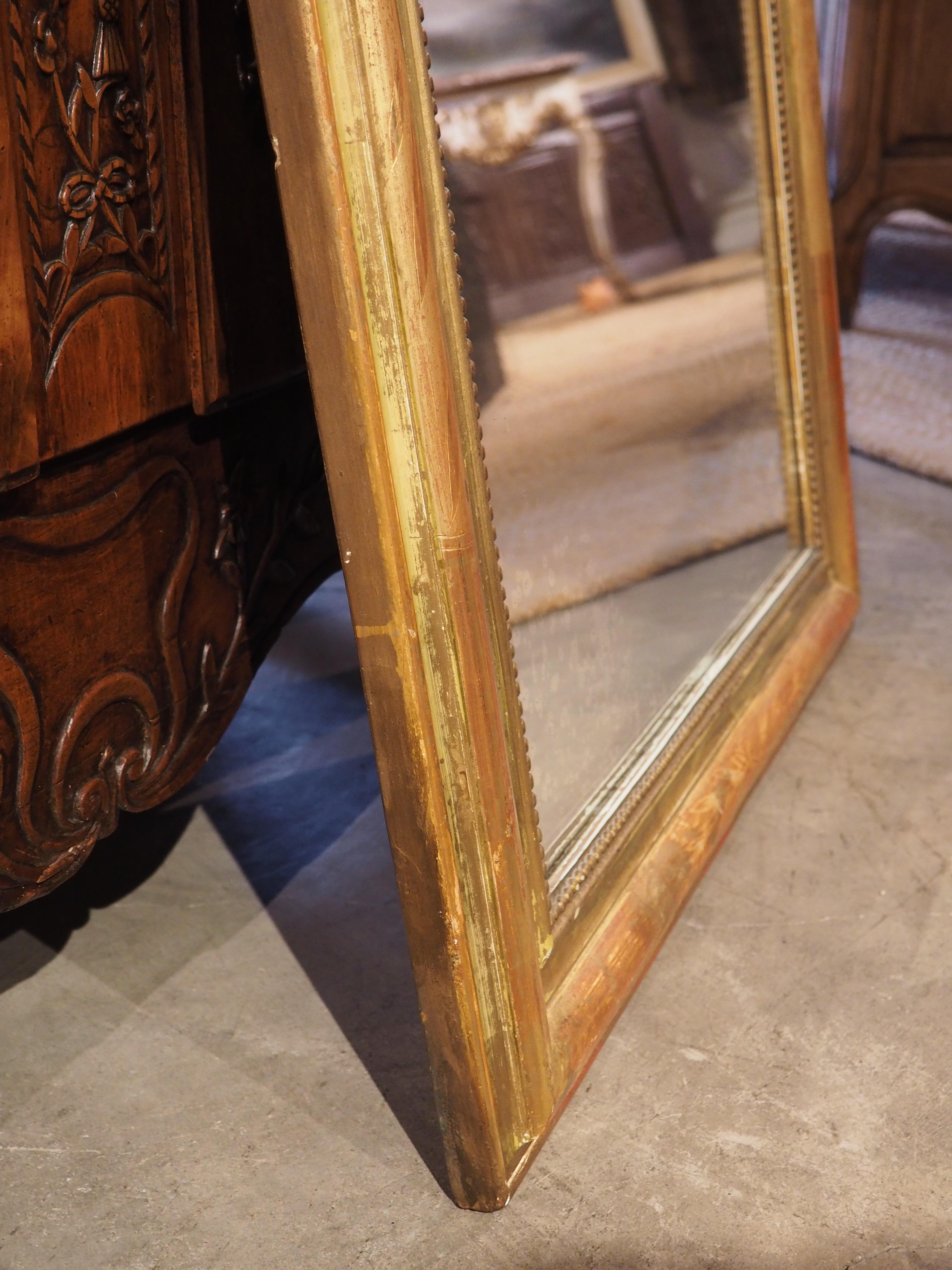 French Louis Philippe mirrors, such as this 19th-century giltwood version, are always in high demand; they are highly versatile pieces that mesh well with just about any style of interior design. Their subtle embellishments, in this case, a