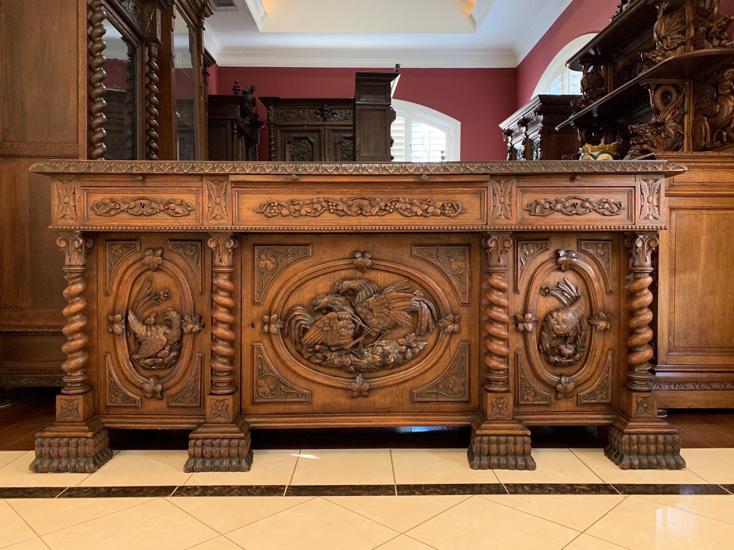 19th century French hunt sideboard buffet carved oak chicken barley twist Louis XIII

~Direct from France~
~Fabulous carvings on this large, 6.5 ft. antique French sideboard!~
~Superb Black Forest carvings feature life-like chickens and chicks,