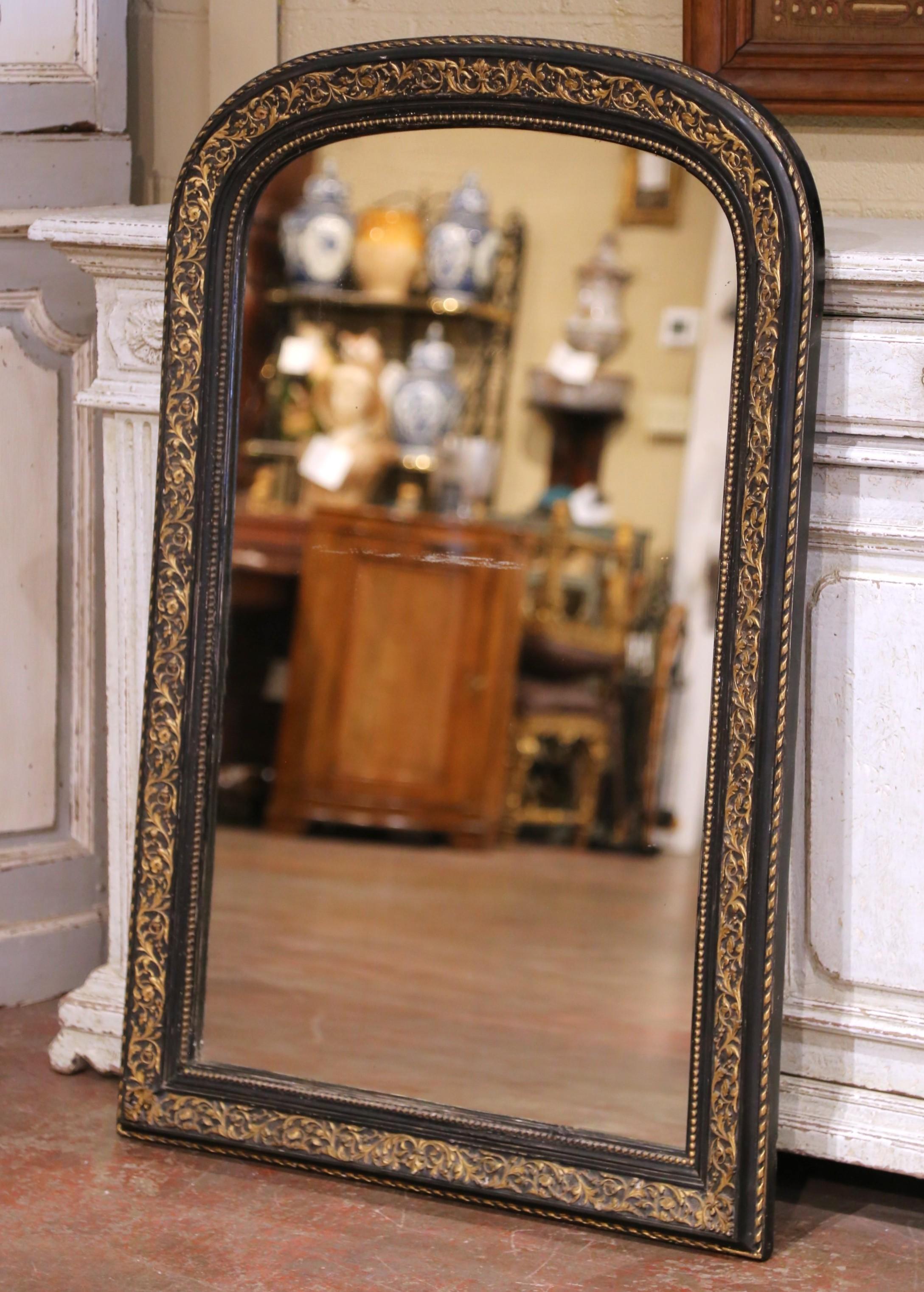 Elevate a powder room or entryway with this elegant antique Louis Philippe mirror, crafted in France circa 1870. The arched frame features the classic restrained lines of the period, enriched by a sophisticated two-tone finish, matte black with