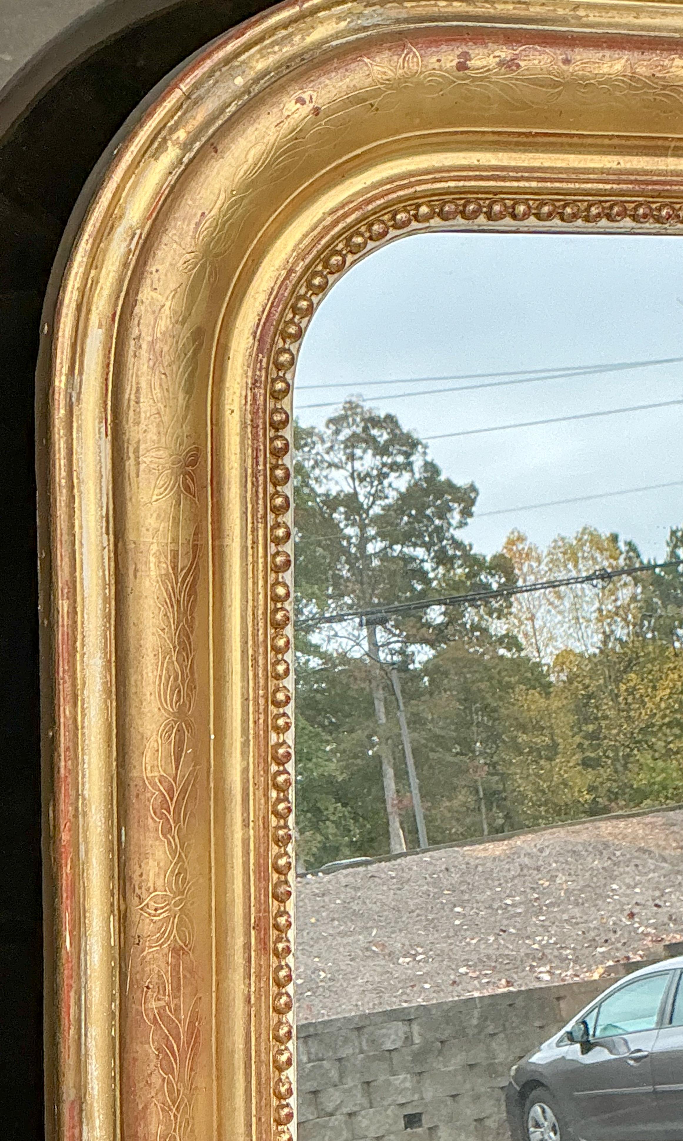 This is a beautiful 19th century Louis Philippe carved giltwood mirror. The water gilt is lovely. Note the carved bead work . It is in very good antique condition. 

Shipping can run two to five weeks. If you need it more quickly, then let me know. 