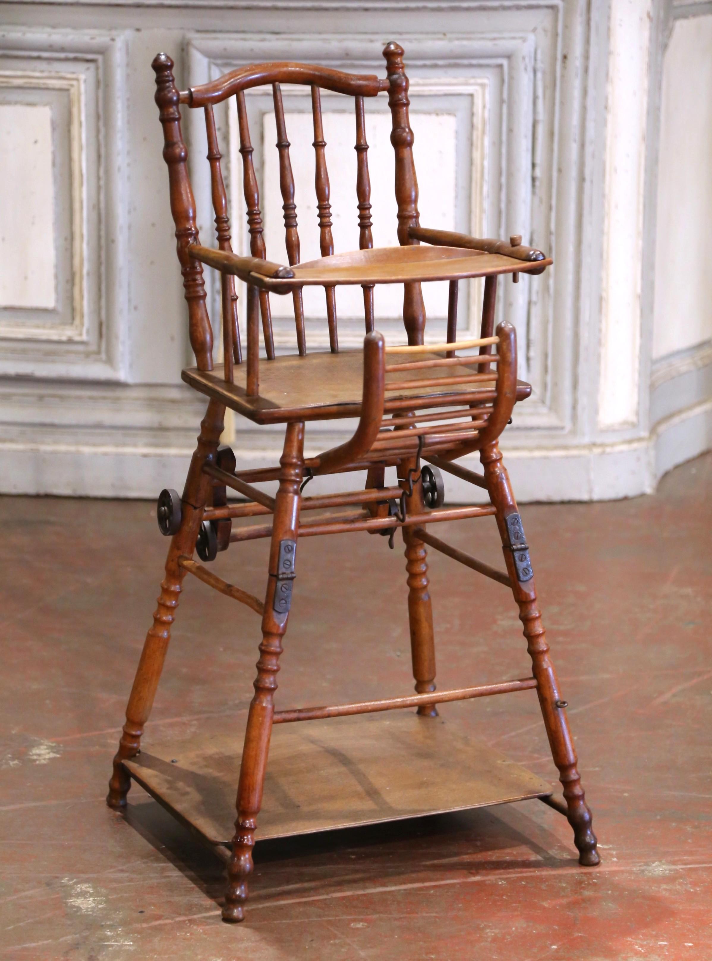 A rare and multi functional French metamorphic high chair in the Louis Philippe style, crafted circa 1860 from solid walnut with a warm, timeworn patina. Ingeniously designed to convert from a high chair into a low rolling pram or play chair, this