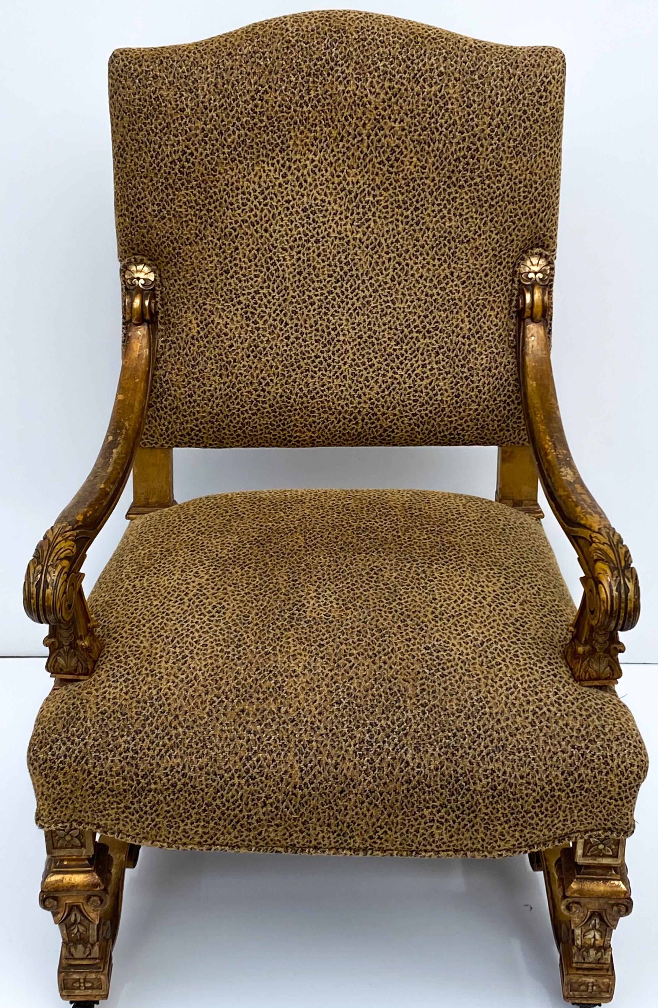 This is a 19th century, French Louis XIV style giltwood bergere chair in vintage leopard fabric. The frame is heavily carved with a shell cartouche on the cross stretcher. The legs have the original casters. It is unmarked.