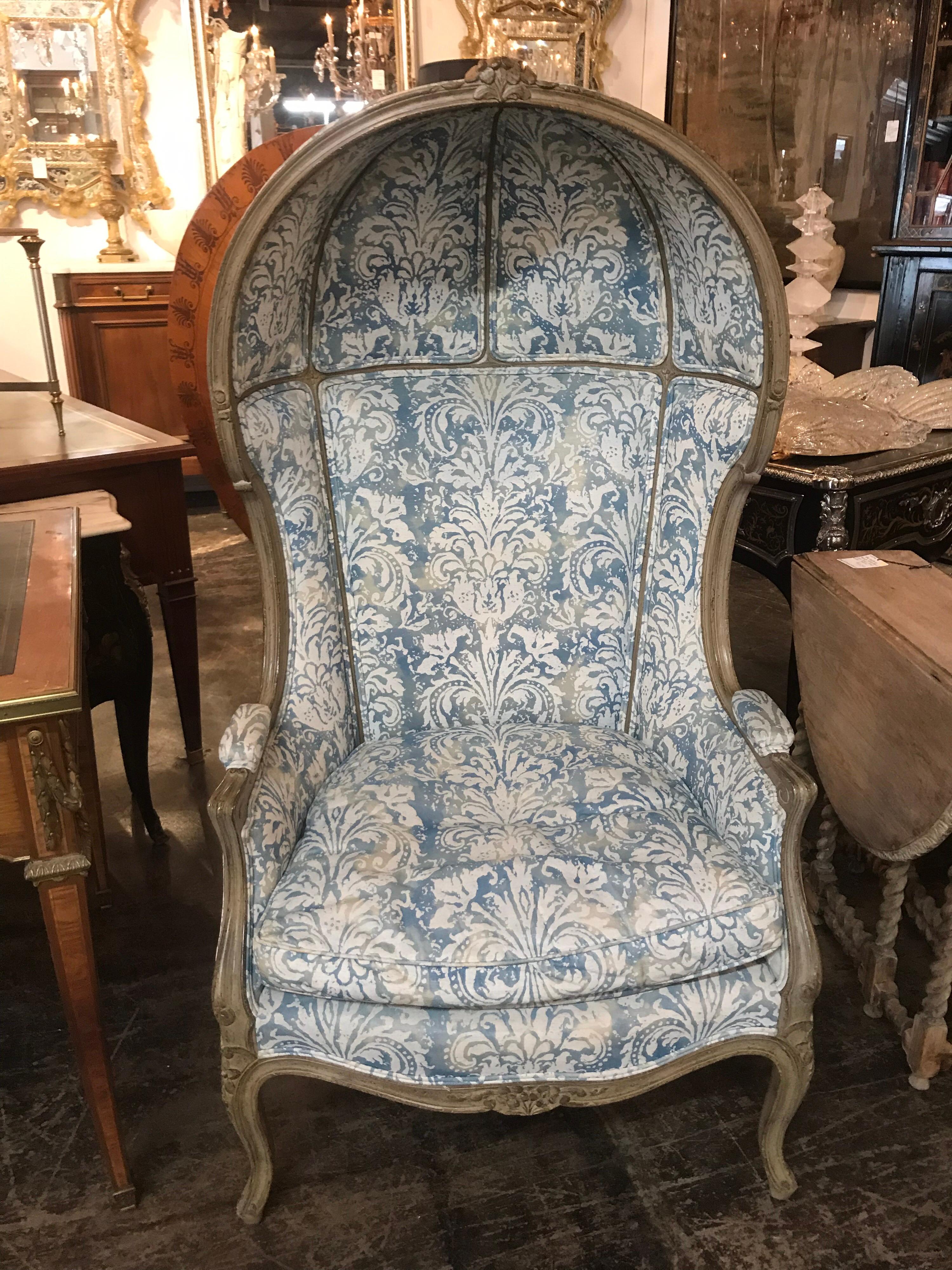 Superb 19th century French bonnet chair recently covered in Fortuny fabric. Having very nice carving and original paint finish, this chair is sure to make a statement!