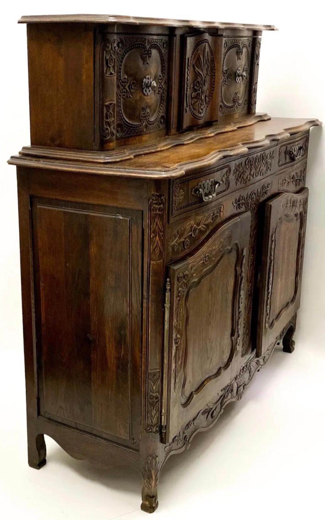 This 19th century Louis XV style oak cabinet has amazing carved details, original pewter hardware and a unique tambour style removable top. The top could be used separately as a wall mounted cabinet. It is a special piece, and does include a key.
It