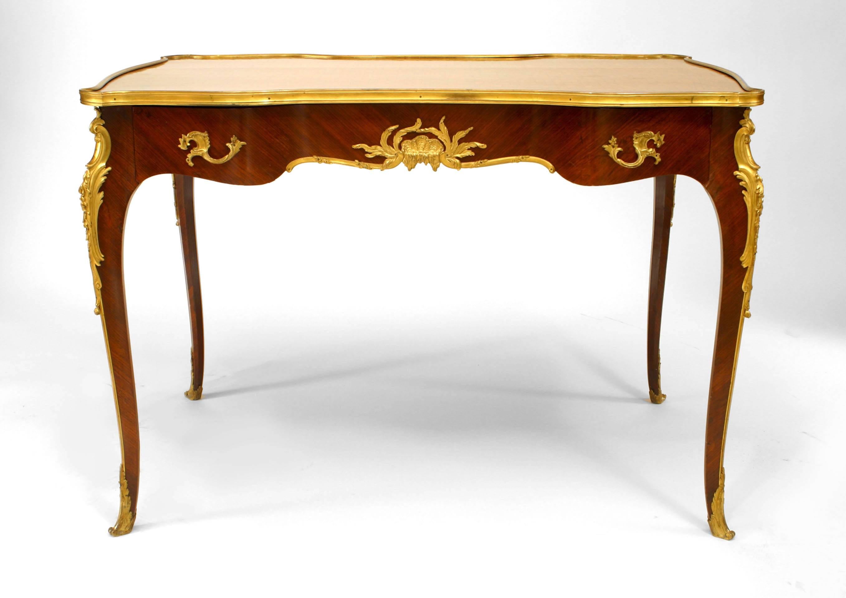 French Louis XV style (19th Century) kingwood table desk with parquetry inlay and floral marquetry border and a single drawer with gilt bronze trim (signed: LINKE)
