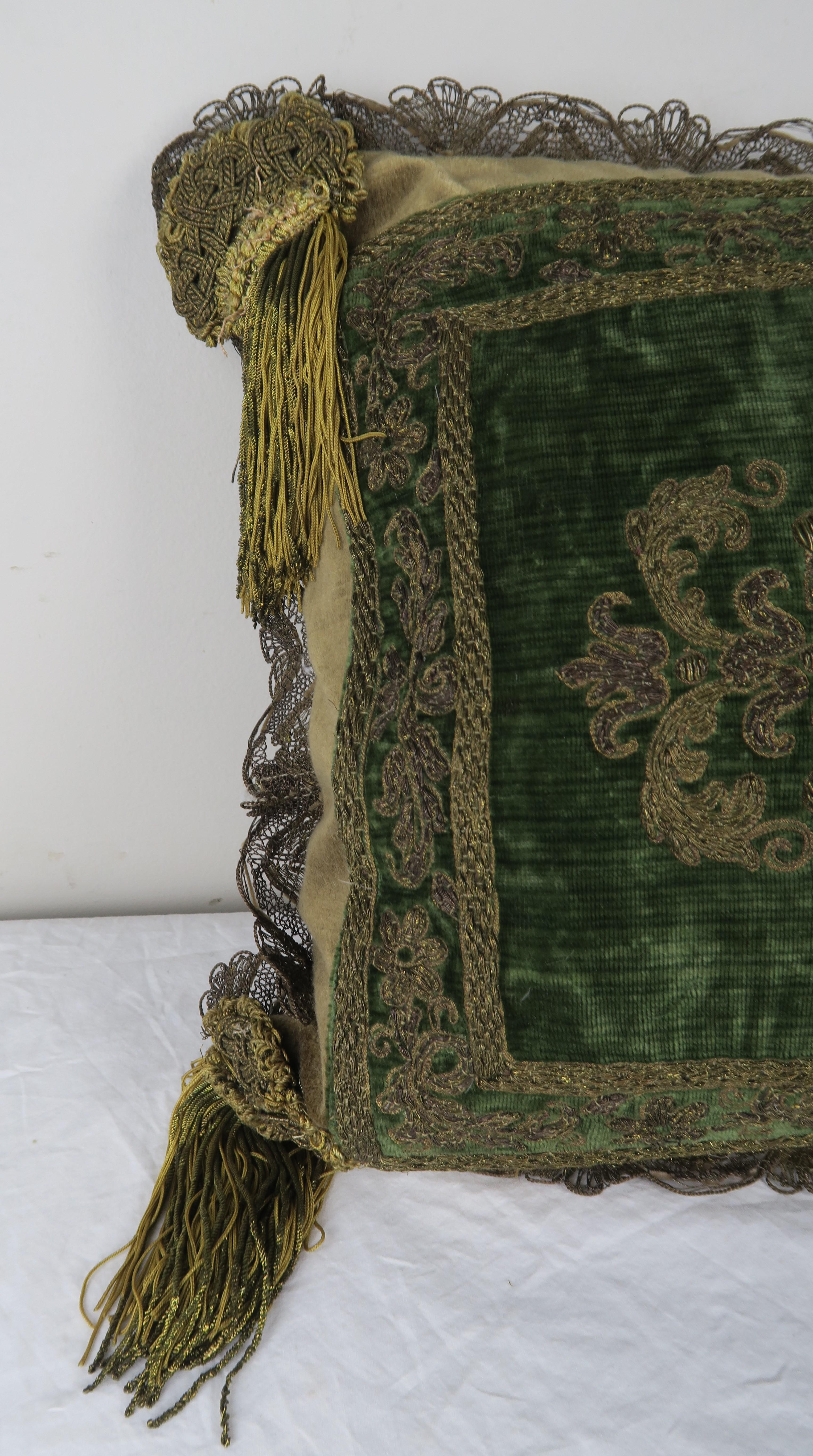 Custom pillow made with a 19th century French gold metallic embroidered green silk velvet textile combined with 19th century metallic fringe, tassels at corners, and silk back. Down filled insert.