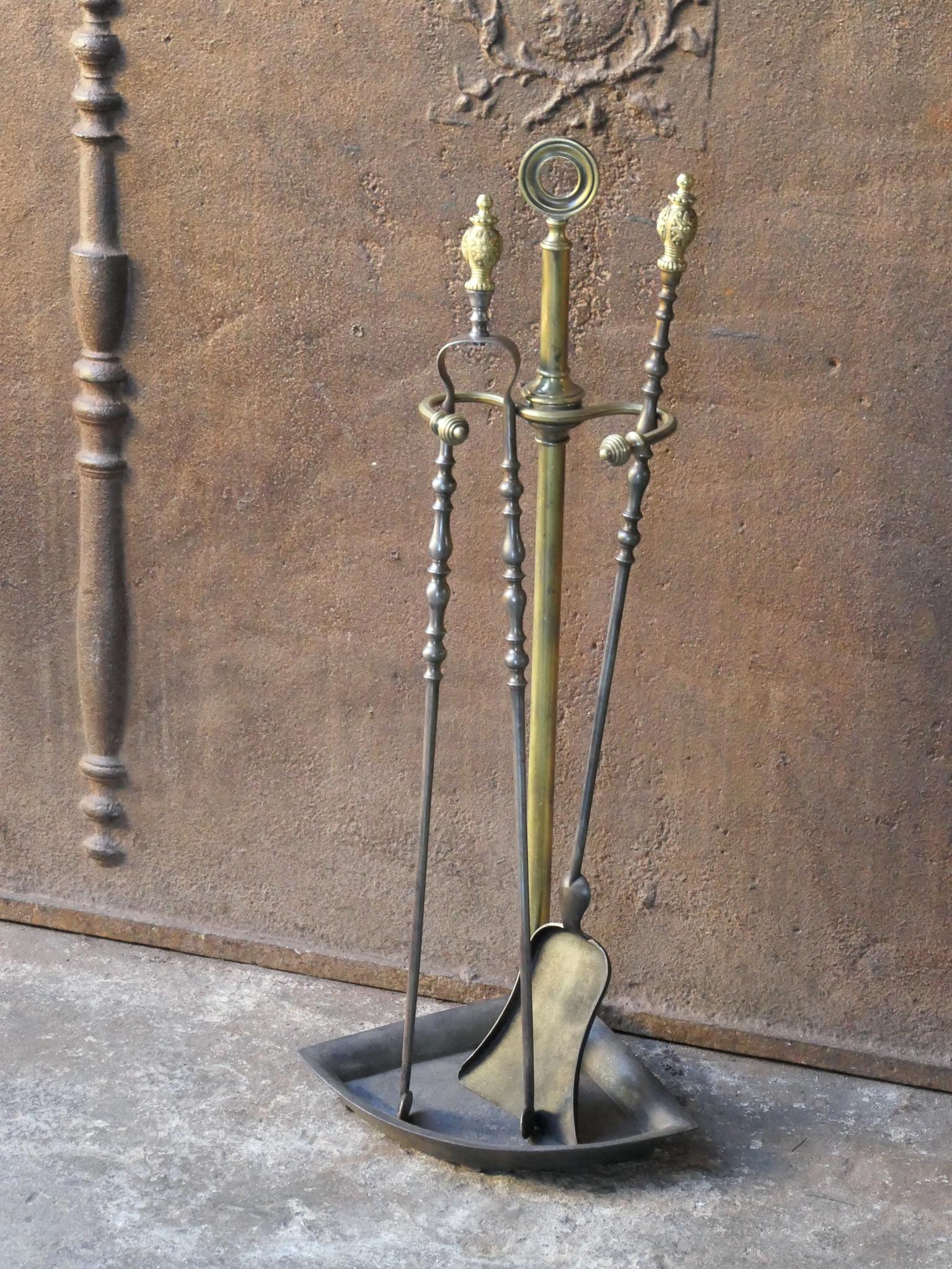 19th Century French Napoleon III companion set. The tool set consists of thongs, shovel and stand. Made of wrought iron and brass. It is in a good condition and is fully functional.
