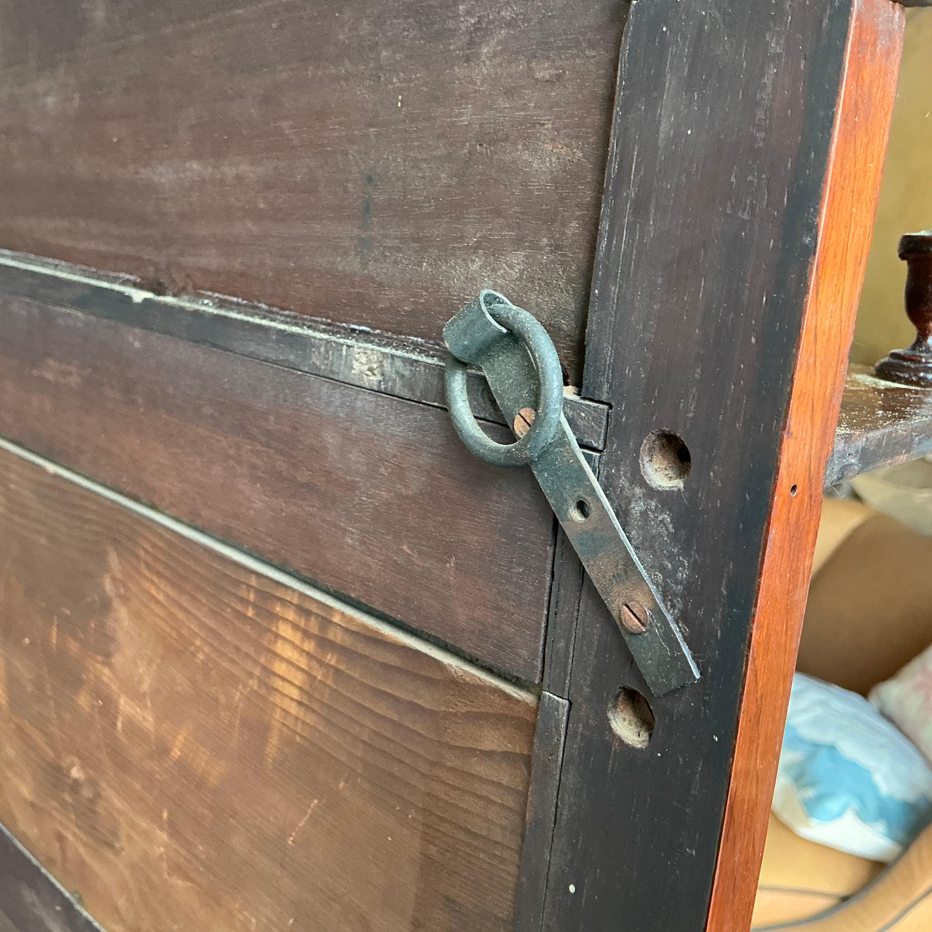 This is a 19th century French wall mounted display cabinet with elaborate marquetry throughout the body. This may even be a salesman sample adapted to be a display piece. The back splash is mirrored. It has lovely neo-classical elements. It is a