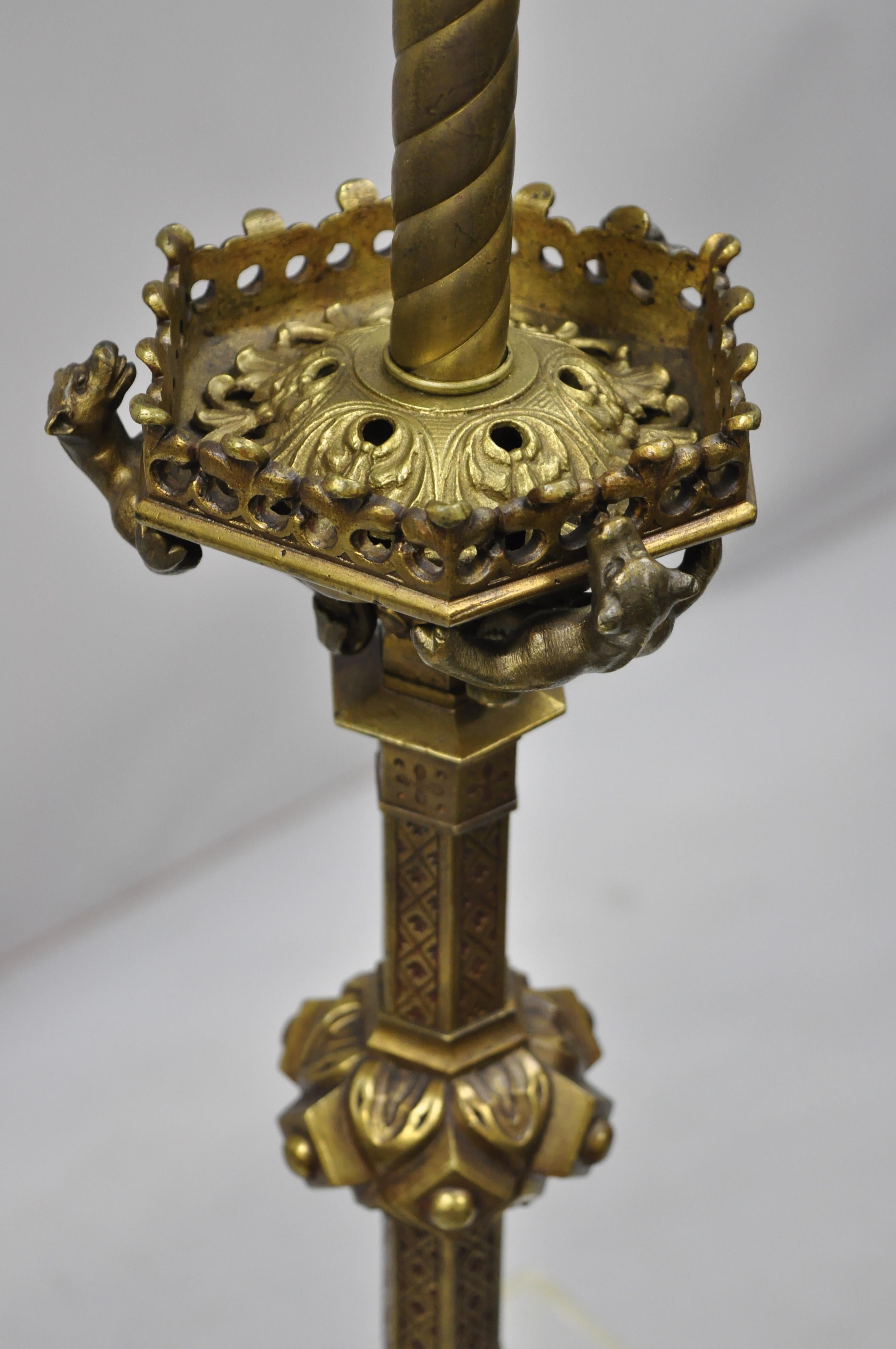 19th century French neoclassical bronze winged griffin candlestick table lamp. Item features winged griffin feet, griffins climbing to the top of the fixture, cast bronze construction, pad feet, very nice antique item, circa 19th century.