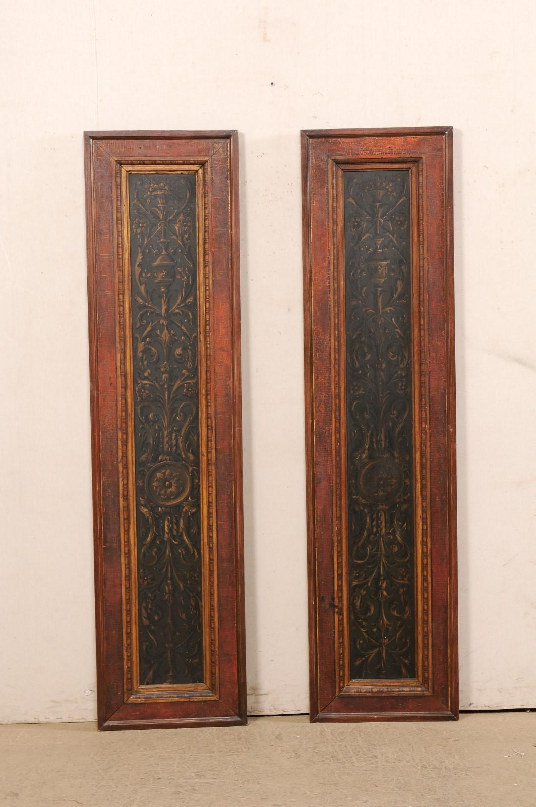 French pair of carved-wood decorative wall panels from the 19th century. This antique pair of wall ornaments from France are each rectangular in shape, with a height over over 6 foot tall, and feature a hand-painted center panel in a beautiful