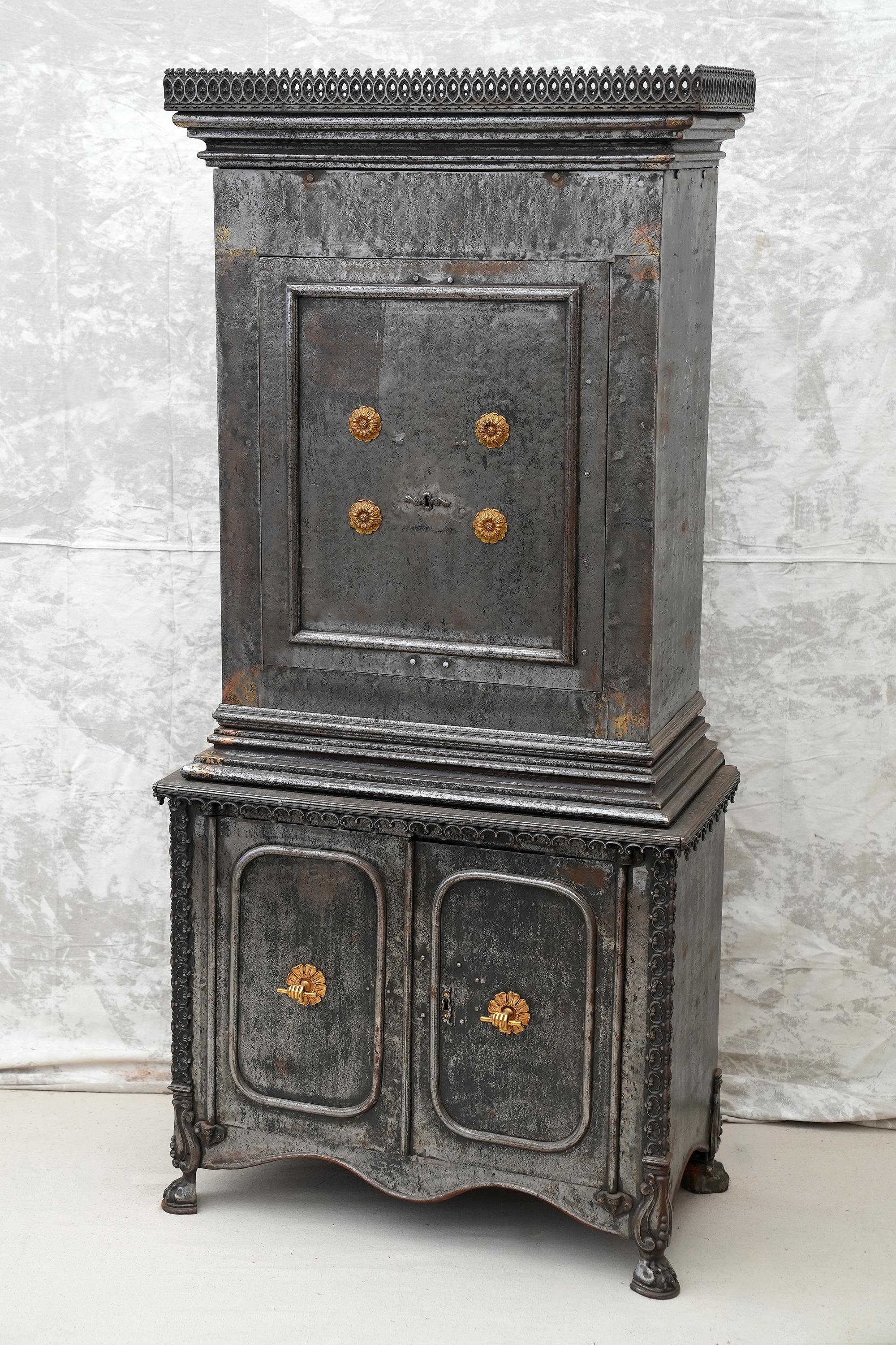 Early 18th-19th c. French steel safe cabinet.
Two part cabinet on paw feet. Complete steel construction with bronze pulls. Amazing function and style. Working locks and keys.