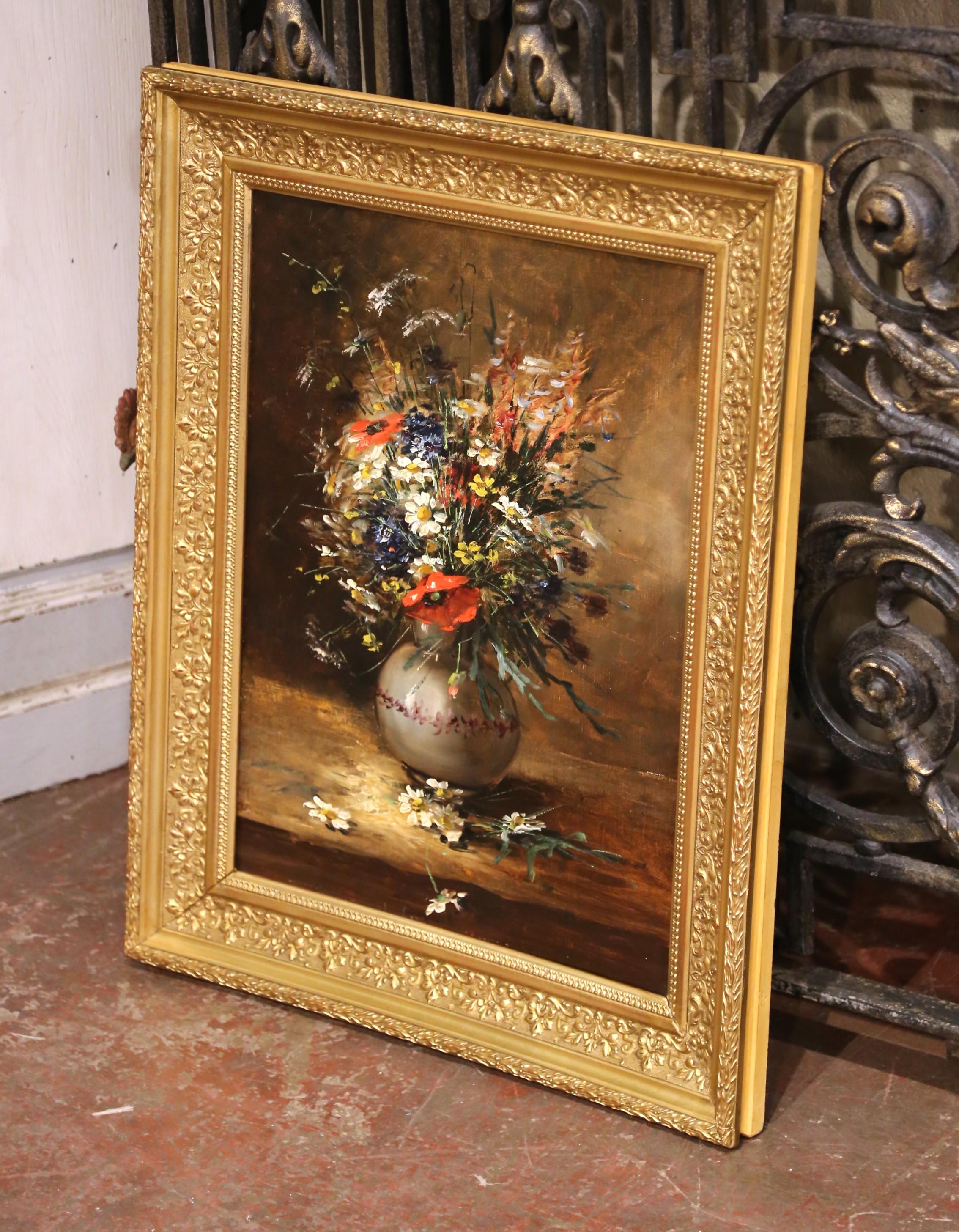 This elegant 19th-century French still life painting depicts a lush bouquet of wildflowers arranged in a simple glazed ceramic vase. Executed in oil on canvas with a richly layered, impasto technique, the work captures a spontaneous yet harmonious
