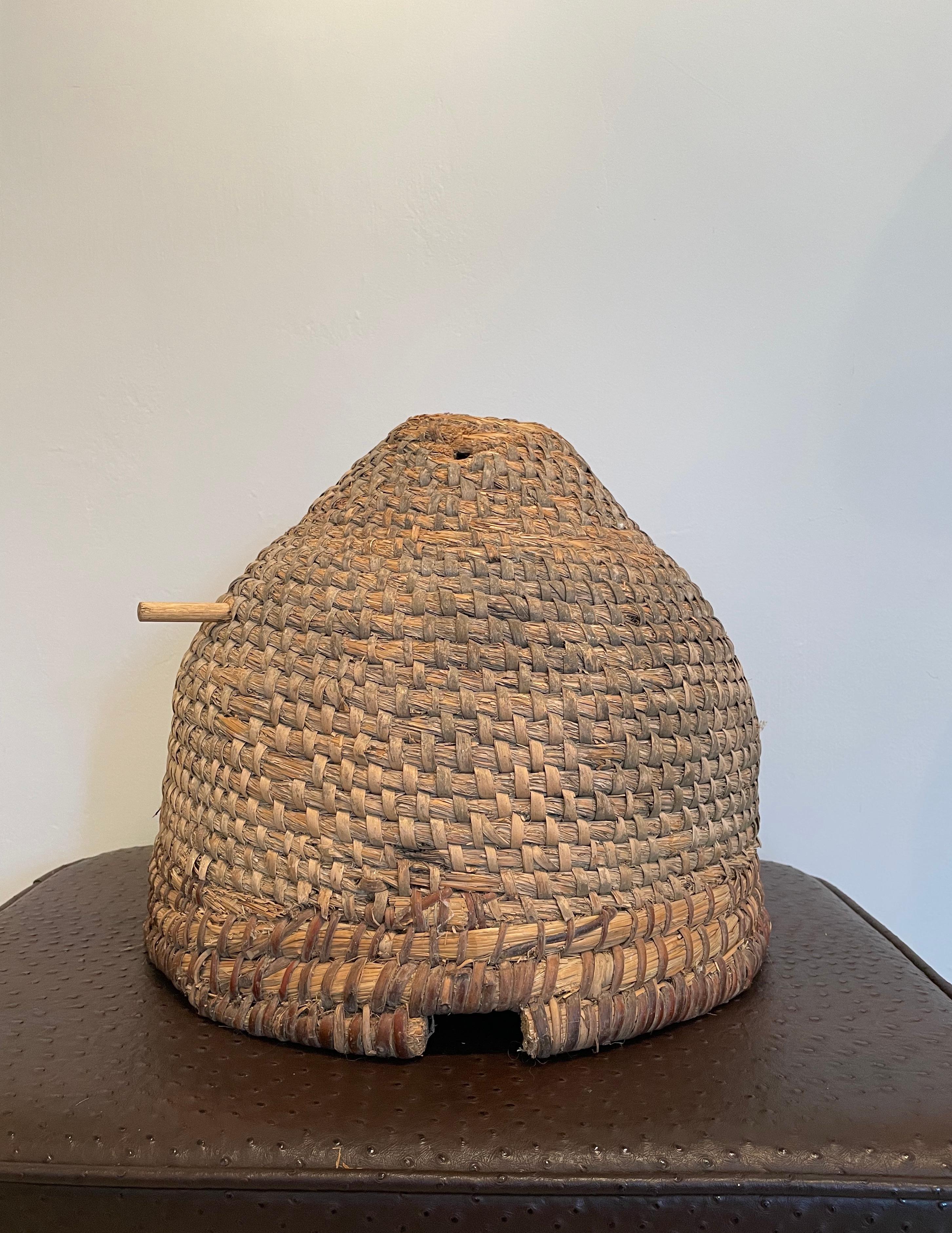 A bee skep is a traditional round hive made of straw or dried grass. Multiple strands of straw are bundled together to form a thick rope and the rope is then coiled and bound together to make the skep.

The word skep is thought to have come from an