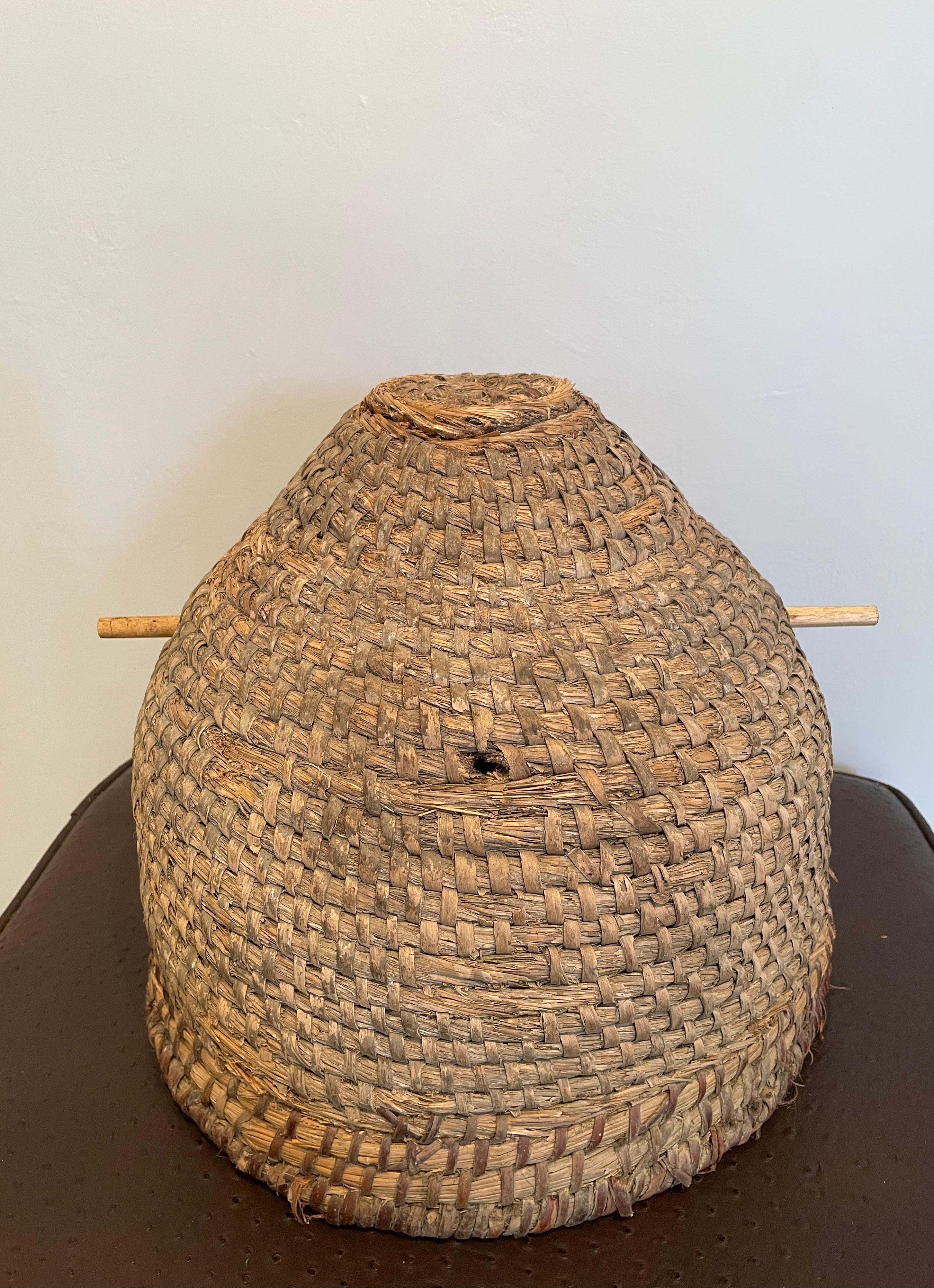 domed beehive made of twisted straw