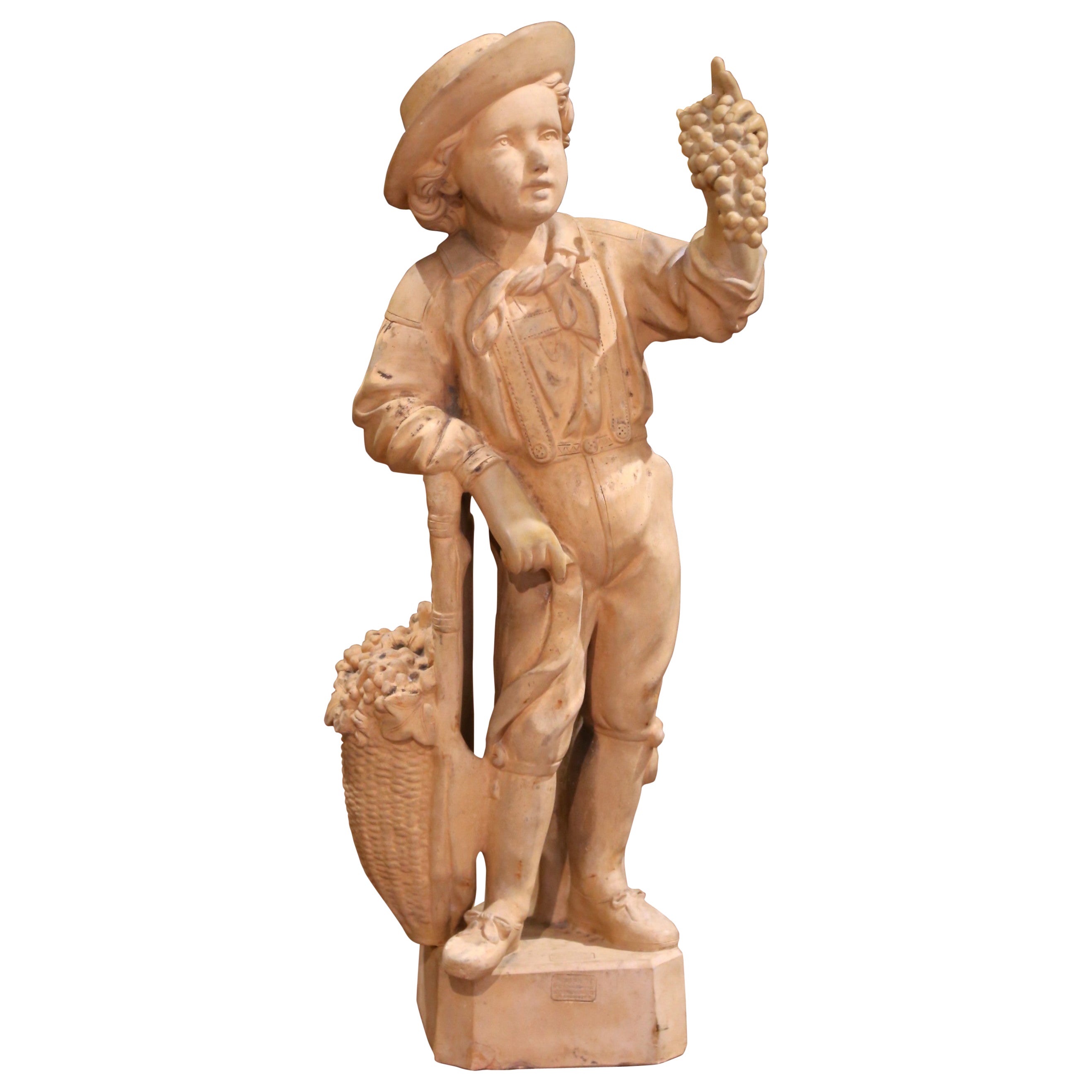 A.I.C. "Le Vendangeur", sculpture en terre cuite française du 19ème siècle, marquée Mandeville et Bernier. en vente