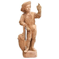 A.I.C. "Le Vendangeur", sculpture en terre cuite française du 19ème siècle, marquée Mandeville et Bernier.