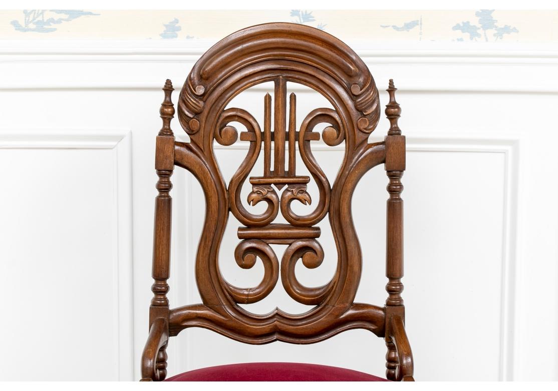 Aesthetic Movement Style chair with fine form. A charming chair with carved openwork arch top back with a center lyre with bird heads within a scrolled frame. The turned sides with finials, and lower scrolled attachments to the seat. Splayed turned
