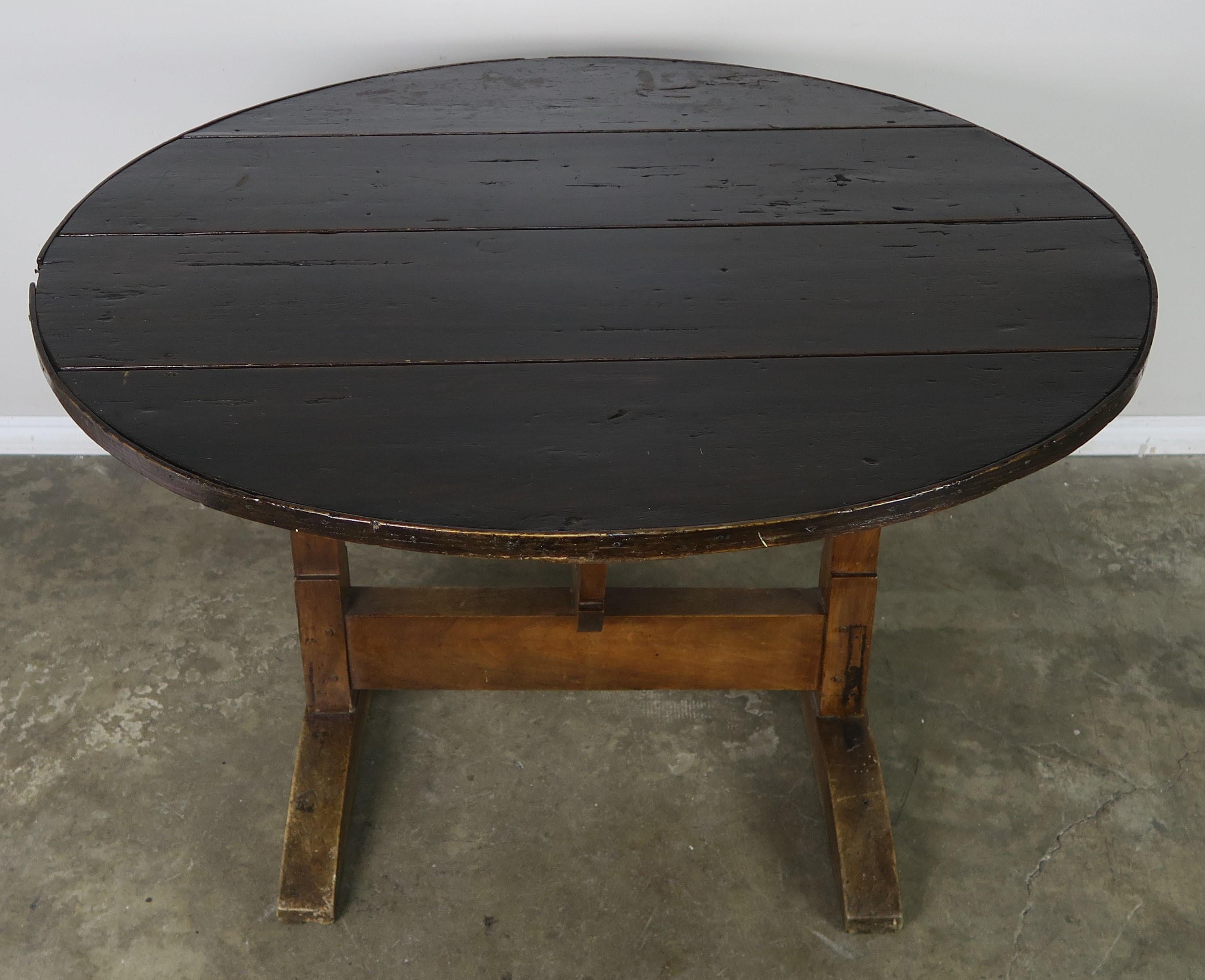 19th century French walnut tilt-top wine tasting table.