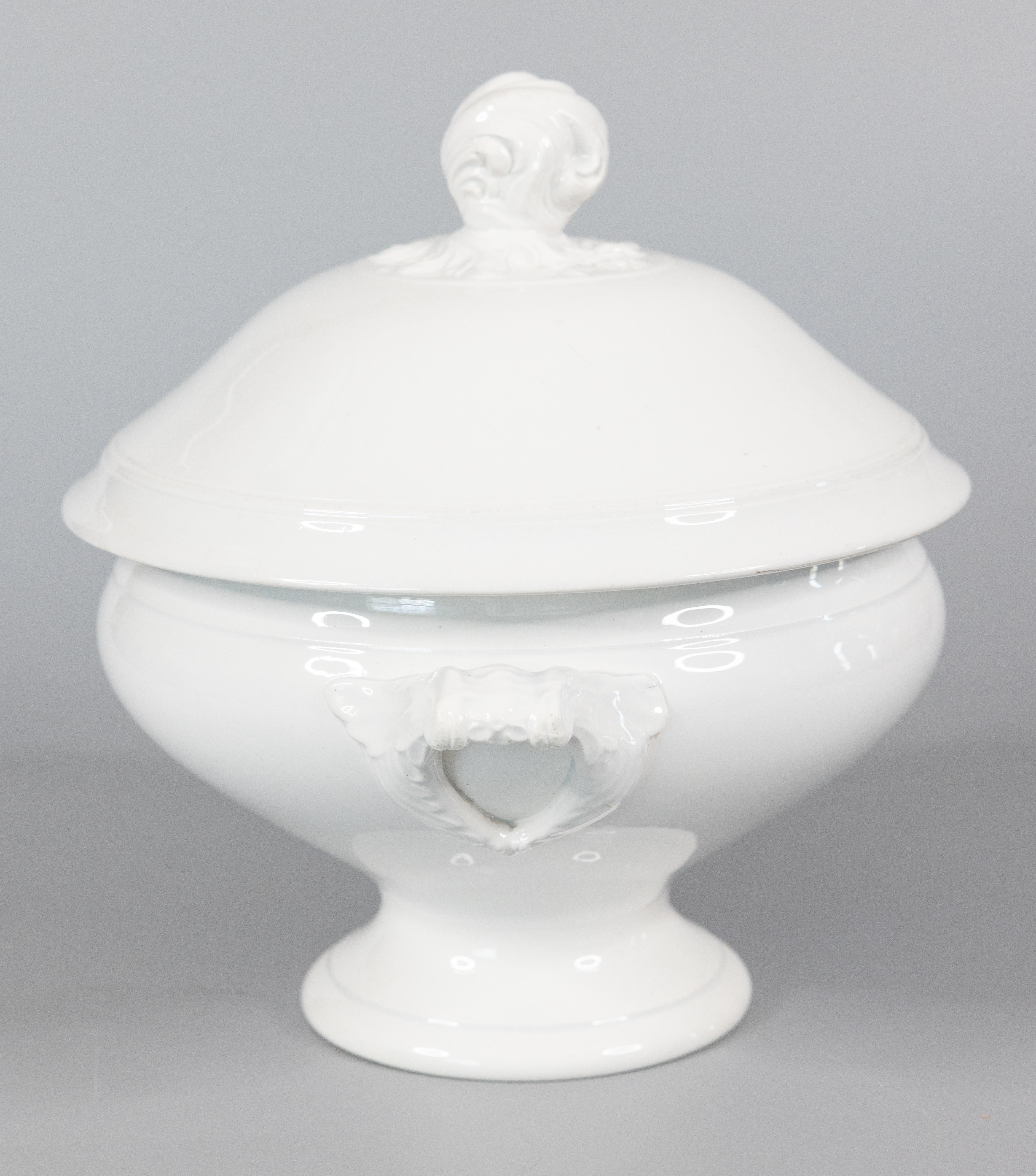 A gorgeous antique French white ironstone lidded soup tureen, circa 1896. Marked 