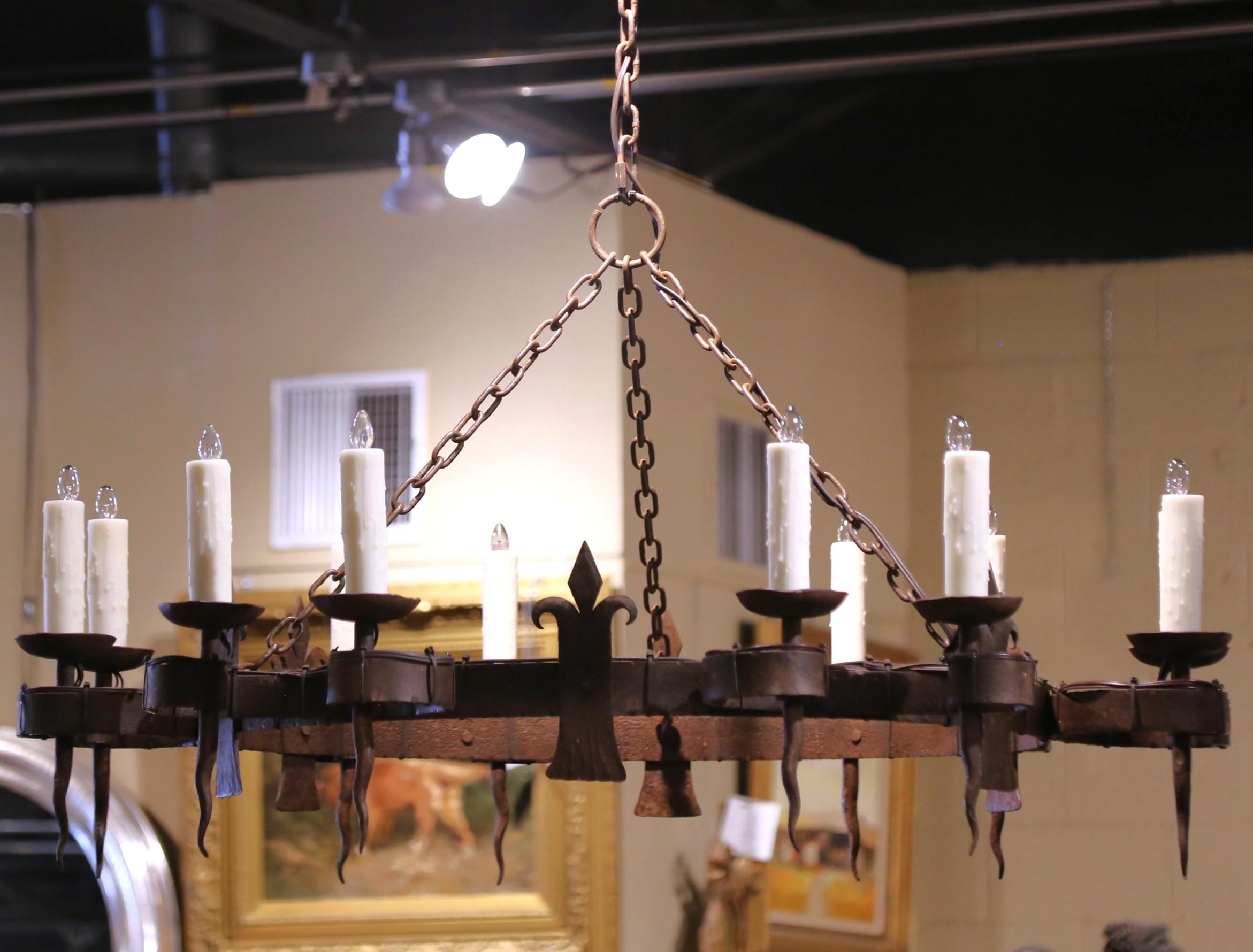 19th C. French Wrought Iron Twelve-Light Chandelier with Fleur-de-Lys Motifs In Excellent Condition For Sale In Dallas, TX