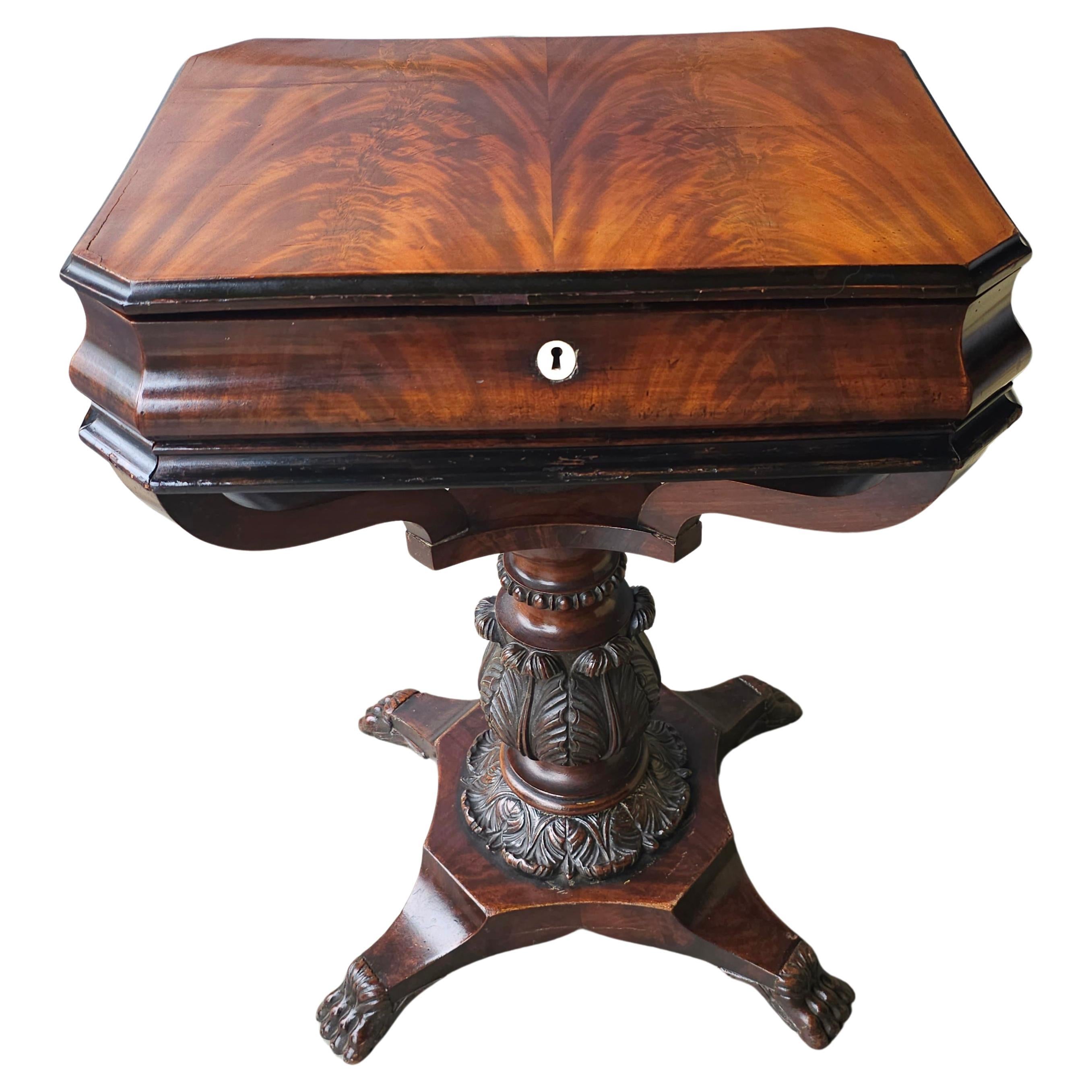 Early 19th Century George IV Partial Ebonized Bookmatched And Carved Mahogany Sewing Stand
The sewing stands Opens to view thirteen graduated, including two 8-slot radial, compartments, predominantly with lids.
Measures 22.5