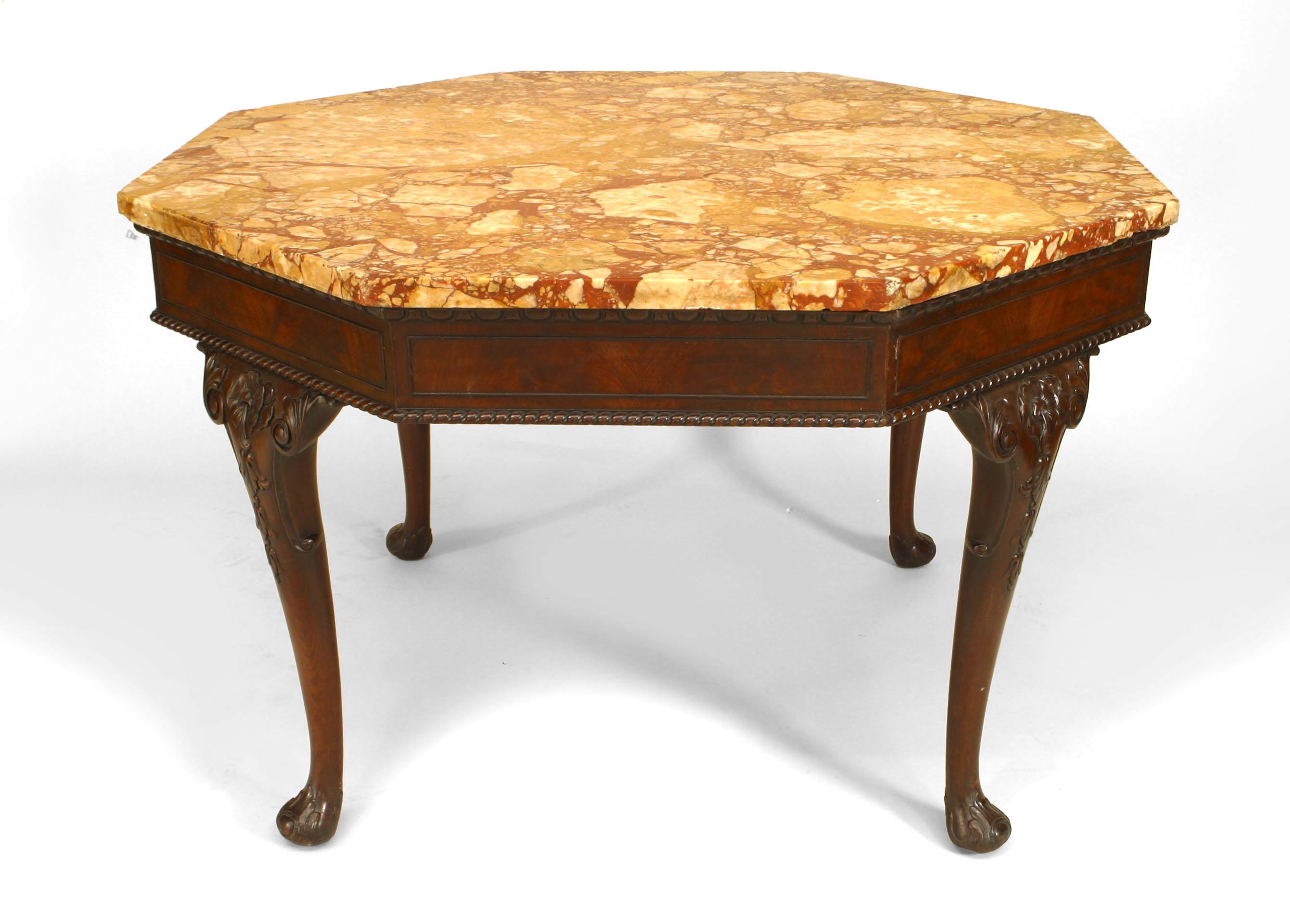 English Chippendale/Georgian (19th Century) mahogany center table with carved cabriole legs supporting an octagonal rouge marble top.
